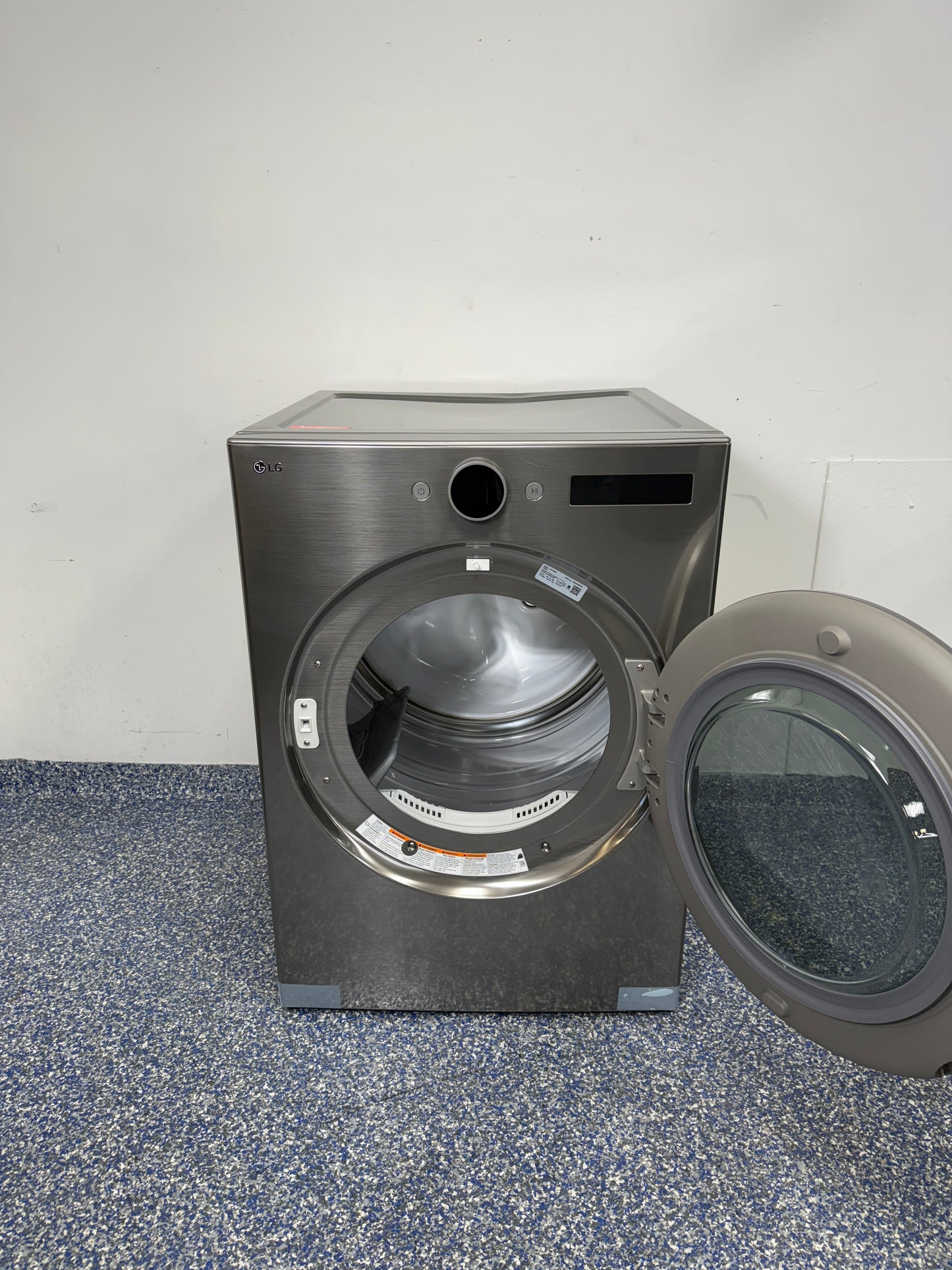 7.4 Cu.Ft. LG Stackable Smart Electric Dryer with FlowSense Duct Clogging & Lint Filter Indicators, Closet Depth Dimensions, LoDecibel Quiet Operation, Reversible Door, Stainless Drum, and Ultra Large Capacity at Appliance Shark Discount Store in Overland Park, Kansas