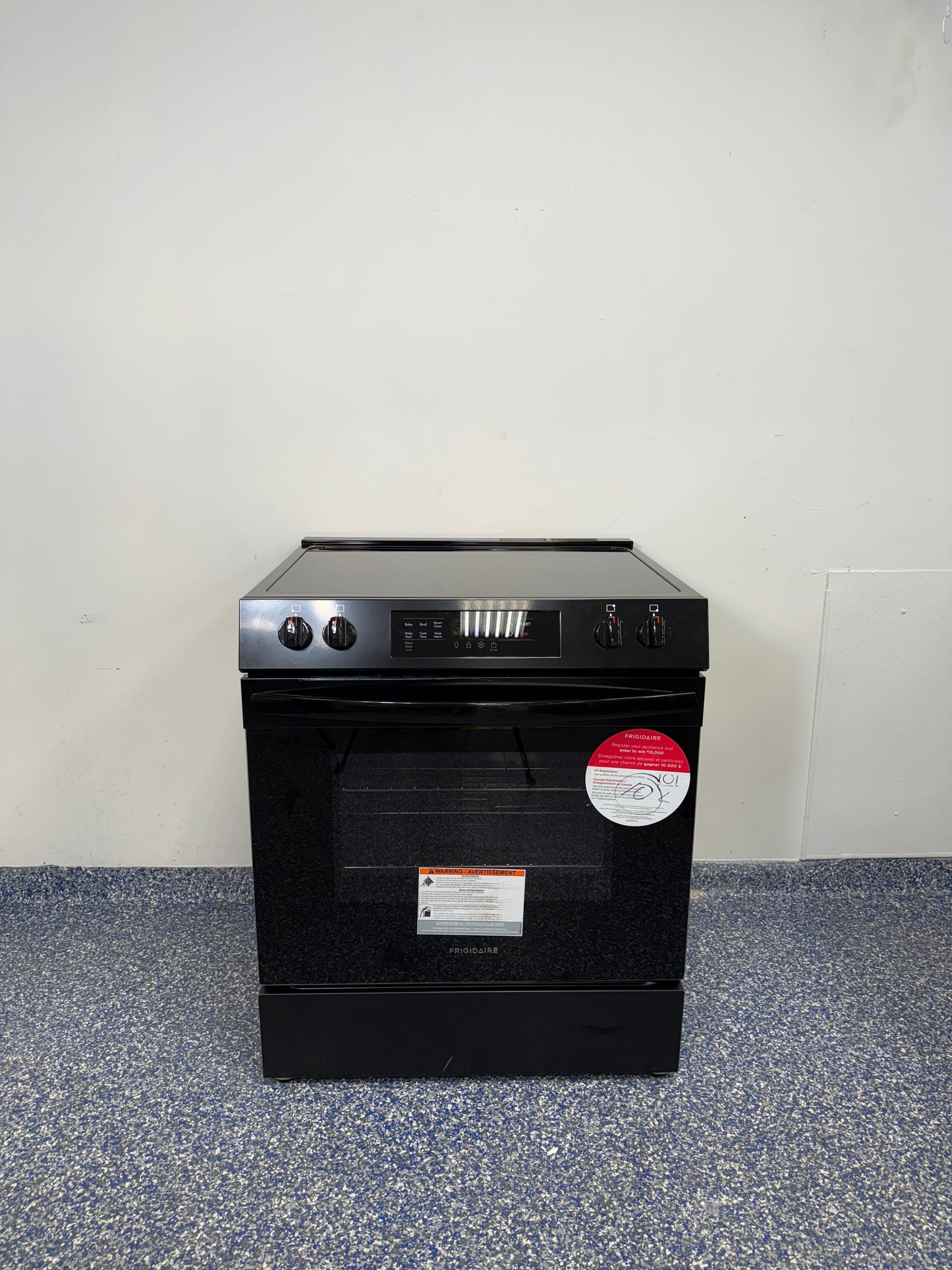 5.3 Cu.Ft. FRIGIDAIRE 5 Element Electric Range with Smooth Surface Glass Top, Extra-Large Oven Capacity, and Hidden Bake Element at Appliance Shark Discount Appliance Store in Kansas City Metro