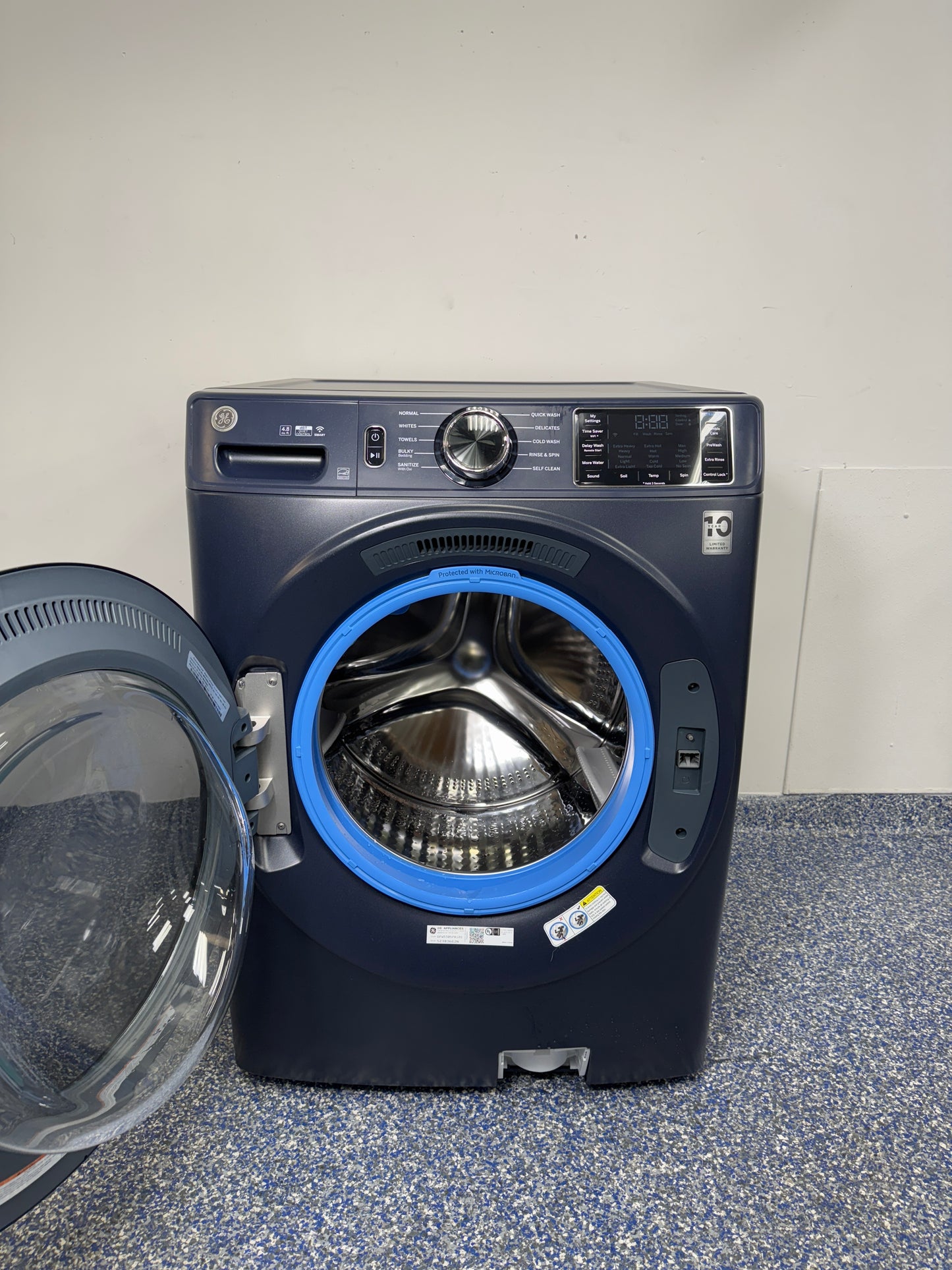 4.8 Cu.Ft. GE Stackable Smart Front Load Washing Machine with UltraFresh Vent System, Microban Technology, Dynamic Balancing Technology, Reversible Door, and Vibration Reduction at Appliance Shark Discount Store in Overland Park, Kansas