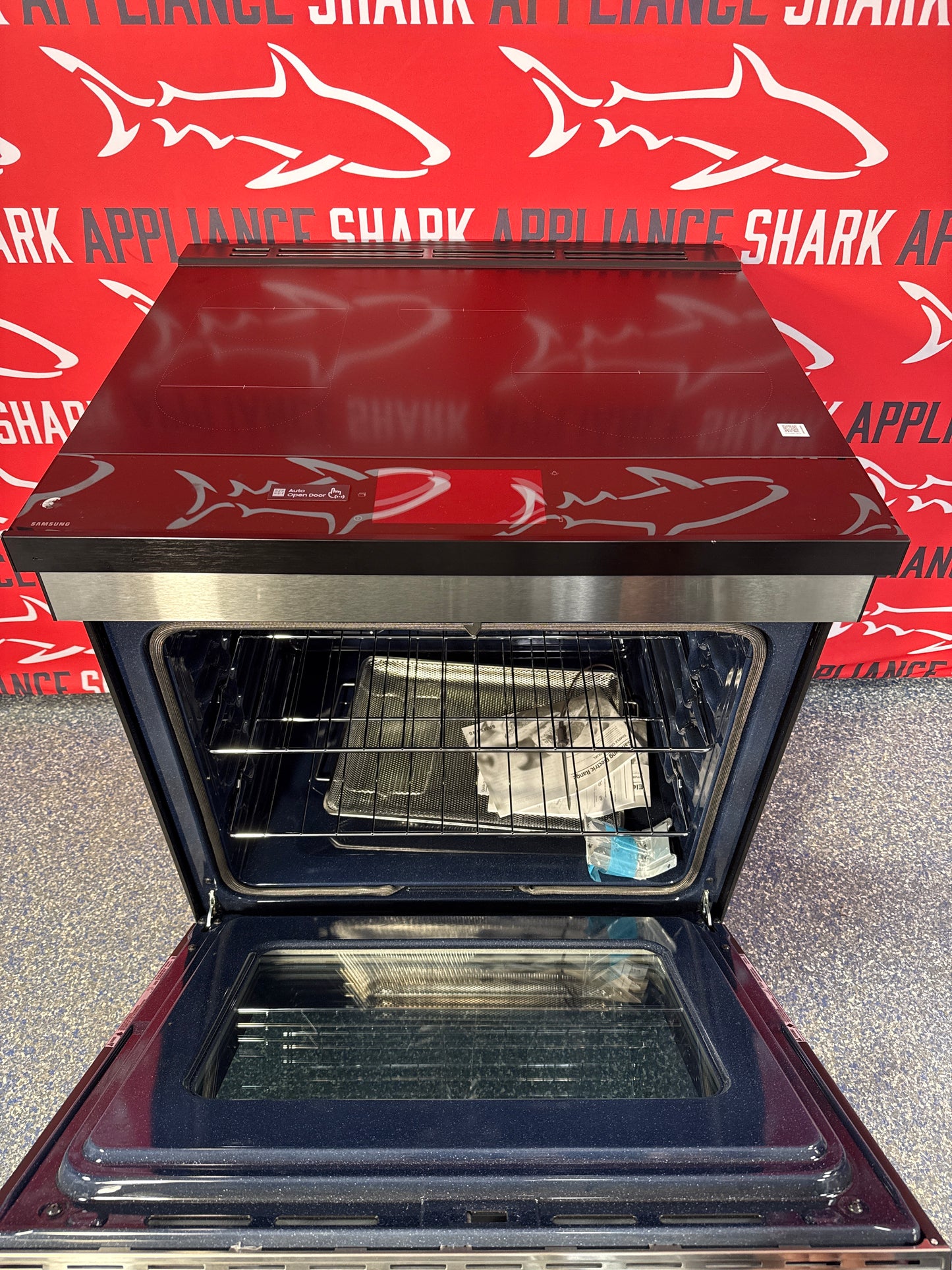 Scratch-dent Samsung slide-in induction range at Appliance Shark. Kansas City's best scratch-dent appliance store.