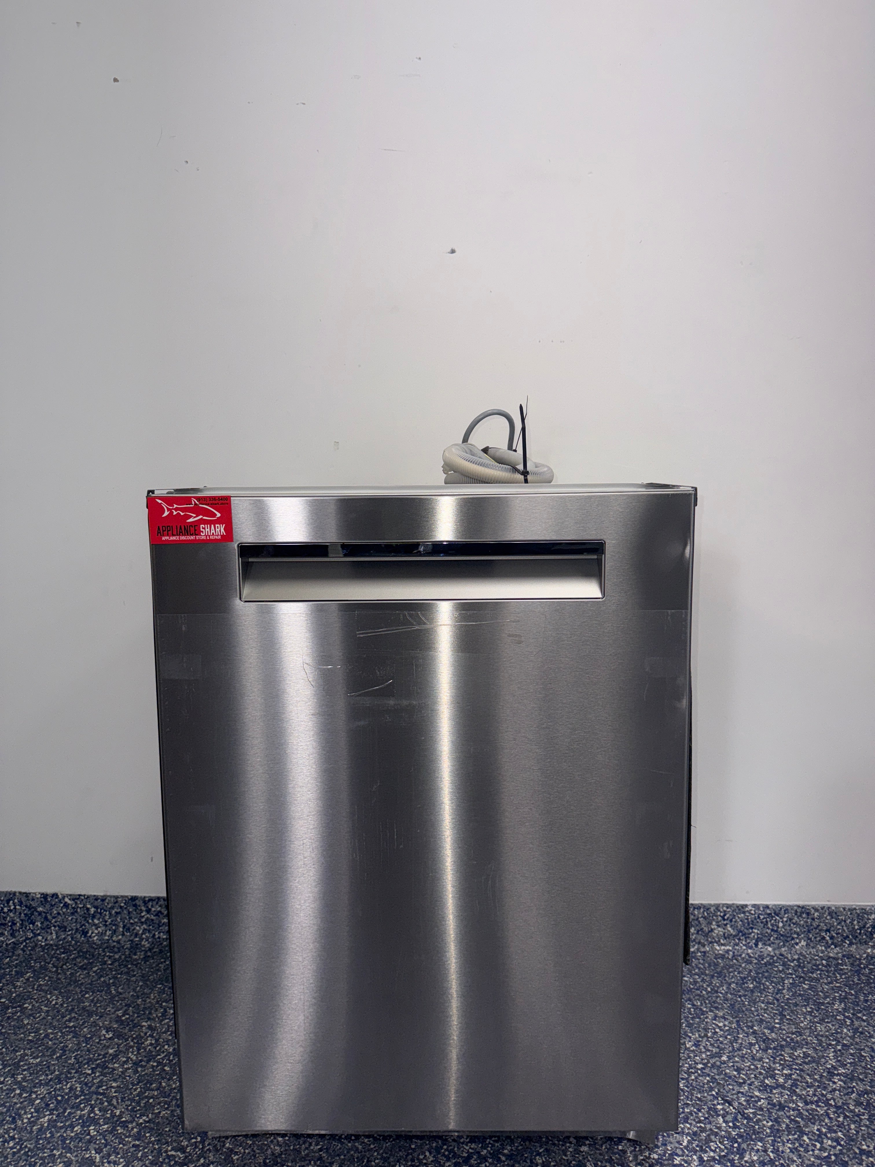 A close-up view of the interior of the BOSCH 500 Series dishwasher, showcasing its flexible 3rd rack, perfect for an Overland Park, KS home.