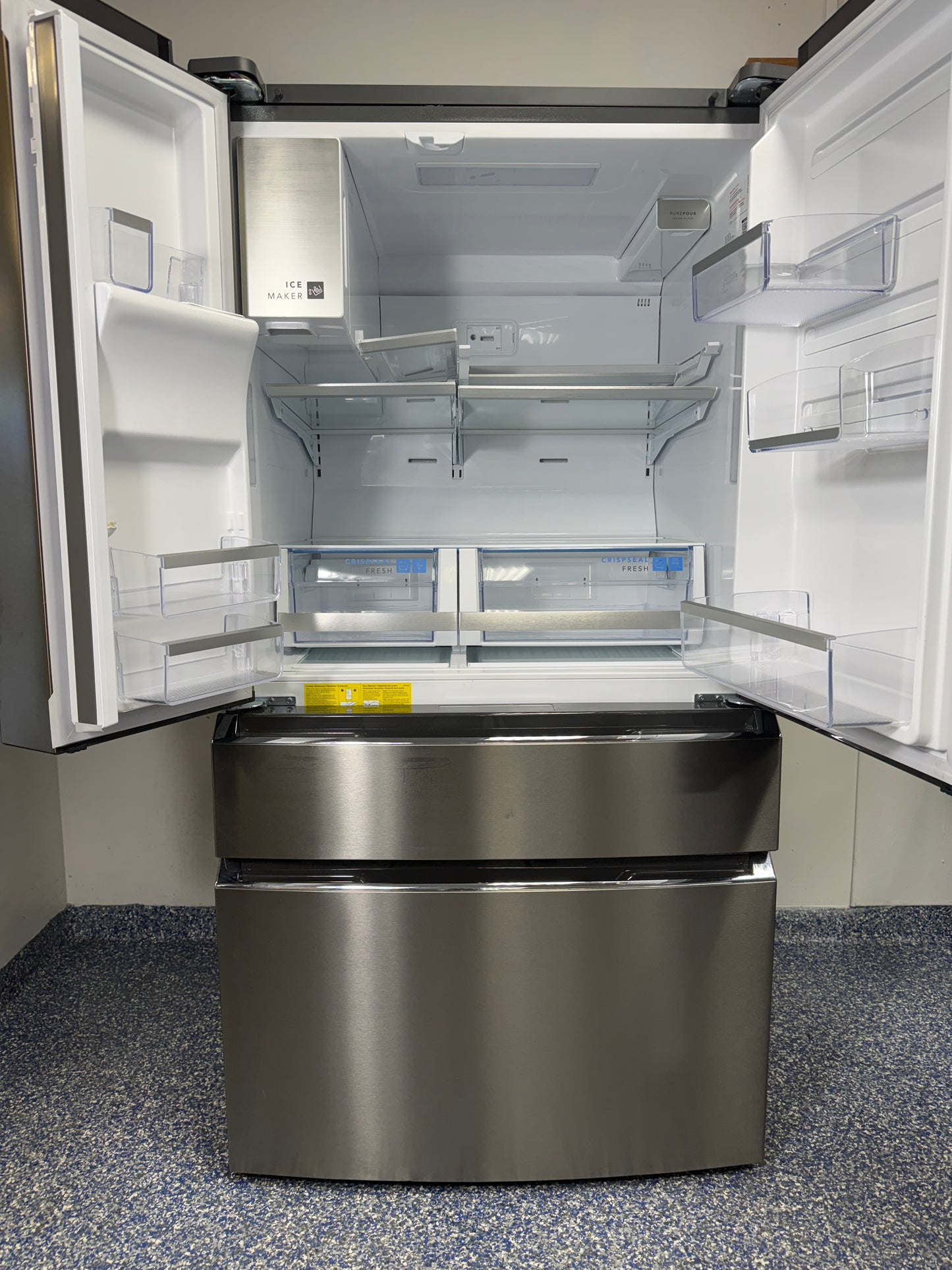 An overhead shot of the FRIGIDAIRE GRMC2273CF with both French doors open, showcasing the flexible SpaceWise® Organization System and LED lighting. On sale at Appliance Shark - Scratch & Dent store | Kansas City.