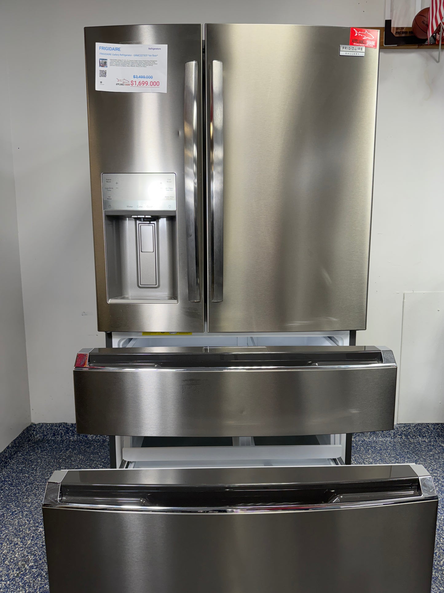 A view inside the bottom freezer drawer of the GRMC2273CF refrigerator, showing the Effortlessâ„¢ Glide Drawers and organized storage. On sale at Appliance Shark - Scratch & Dent store | Kansas City.