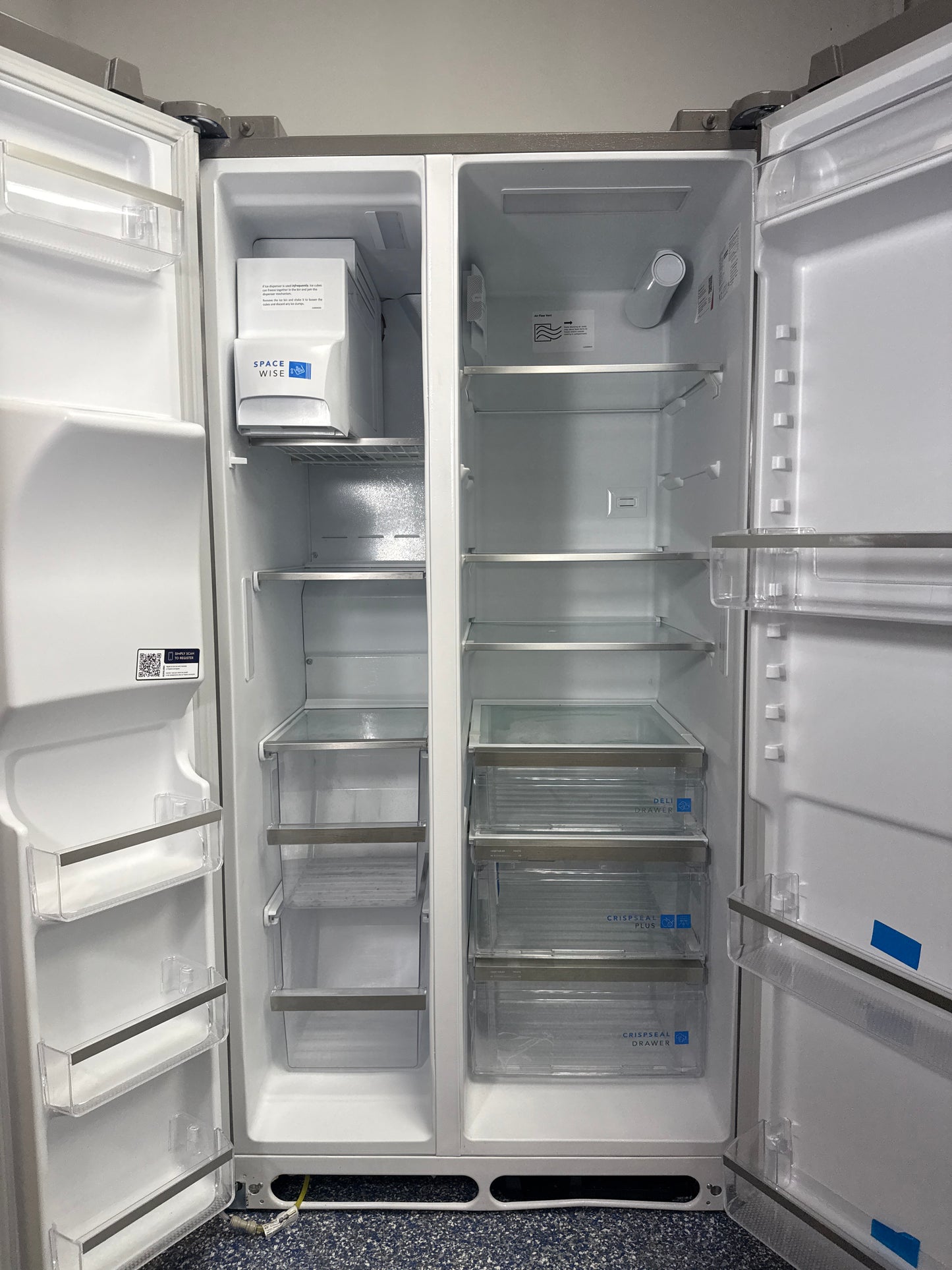 Spacious 25.6 cu. ft. FRIGIDAIRE GRSS2652AFA refrigerator with adjustable shelving, offered as a scratch and dent deal in Kansas City.