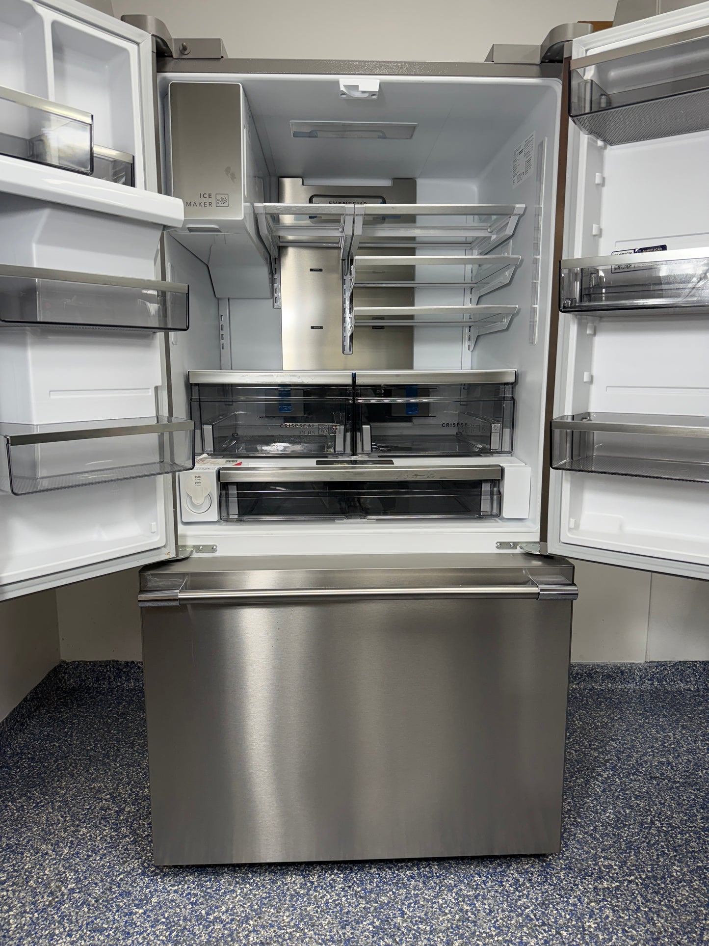 A view inside the main refrigerator compartment of the FRIGIDAIRE PRFS2883AF, highlighting the glass shelves, CrispSeal® Plus crispers, and adjustable temperature drawer. On sale at Appliance Shark - Scratch & Dent store | Kansas City.