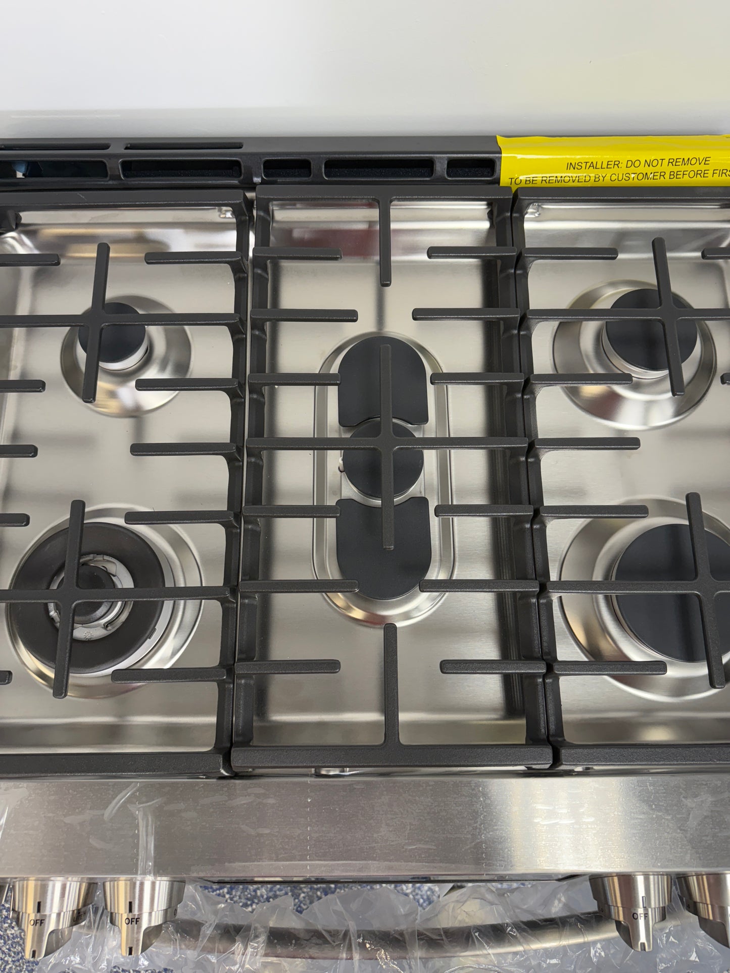 Scratch & dent GE Profile PGS960YPFS gas range displayed at Appliance Shark in Overland Park with double oven design.