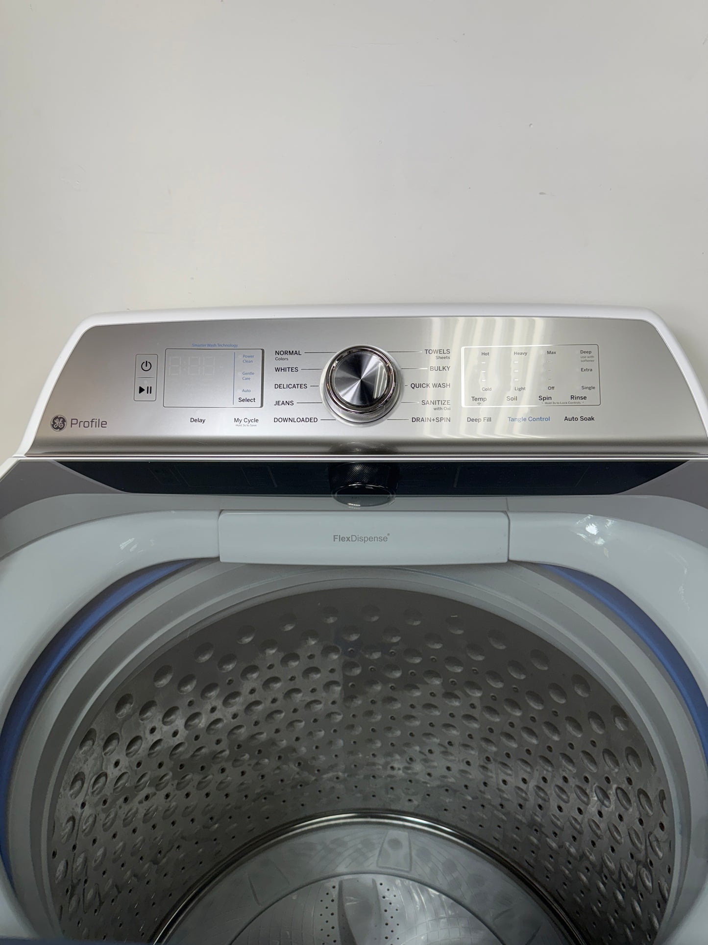 A detailed view of the digital control panel for the GE PTW600BSRWS, showing the cycle selection dial and SmartHQ™ connectivity options. On sale at Appliance Shark - Scratch & Dent store | Kansas City.