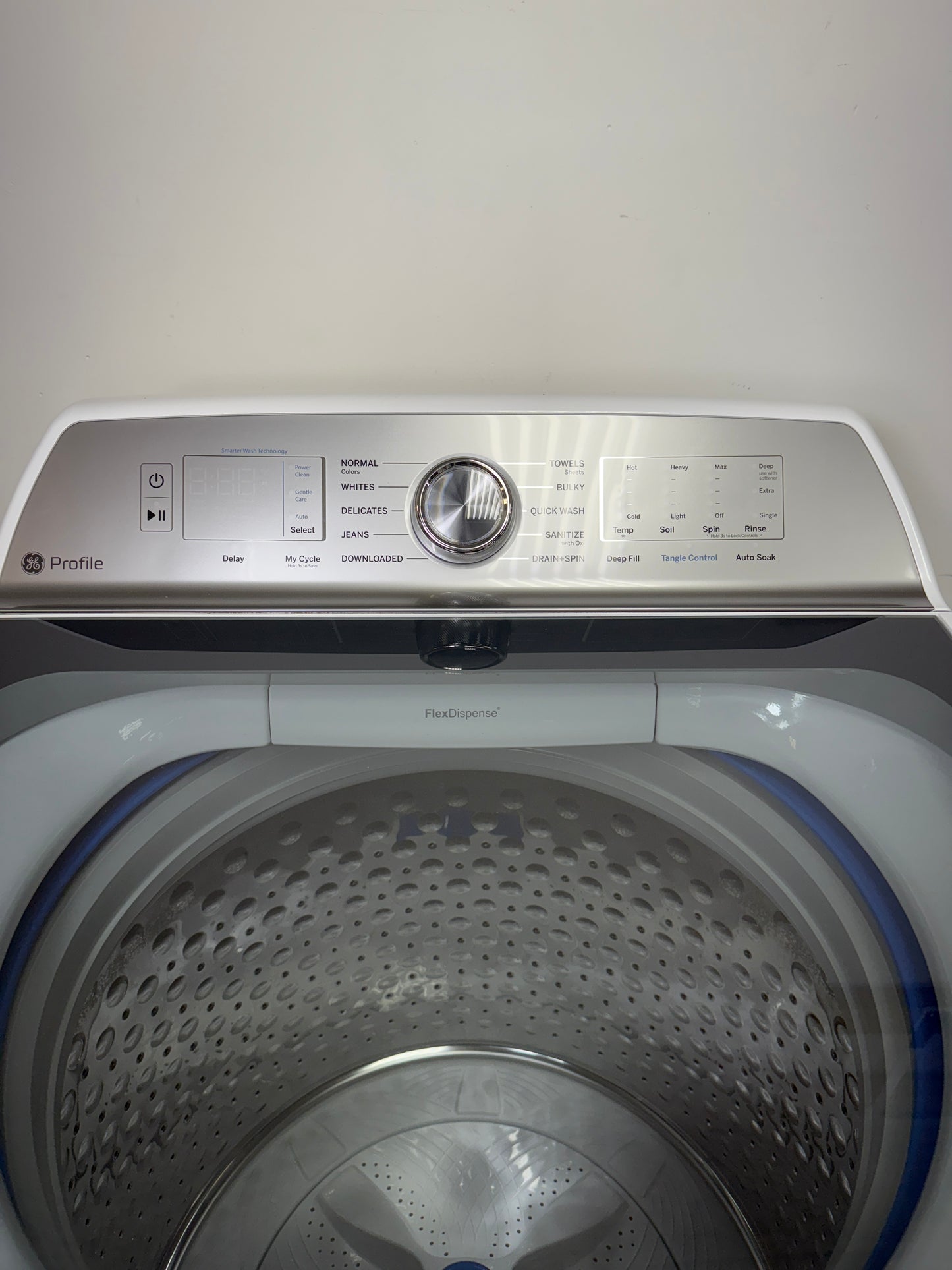 A detailed view of the digital control panel for the GE PTW600BSRWS, showing the cycle selection dial and SmartHQâ„¢ connectivity options. On sale at Appliance Shark - Scratch & Dent store | Kansas City.