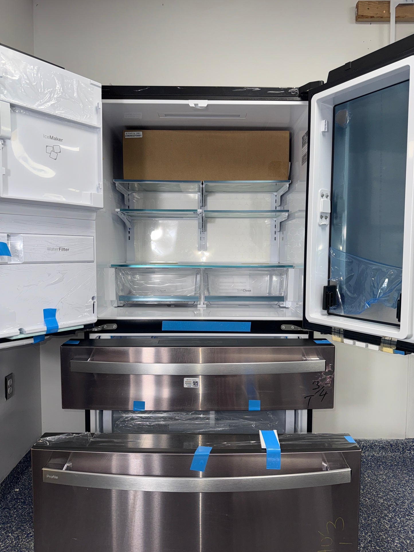 A front view of the GE PXD22BYPFS refrigerator, highlighting its built-in WiFi feature, ready for installation in a Kansas City kitchen.