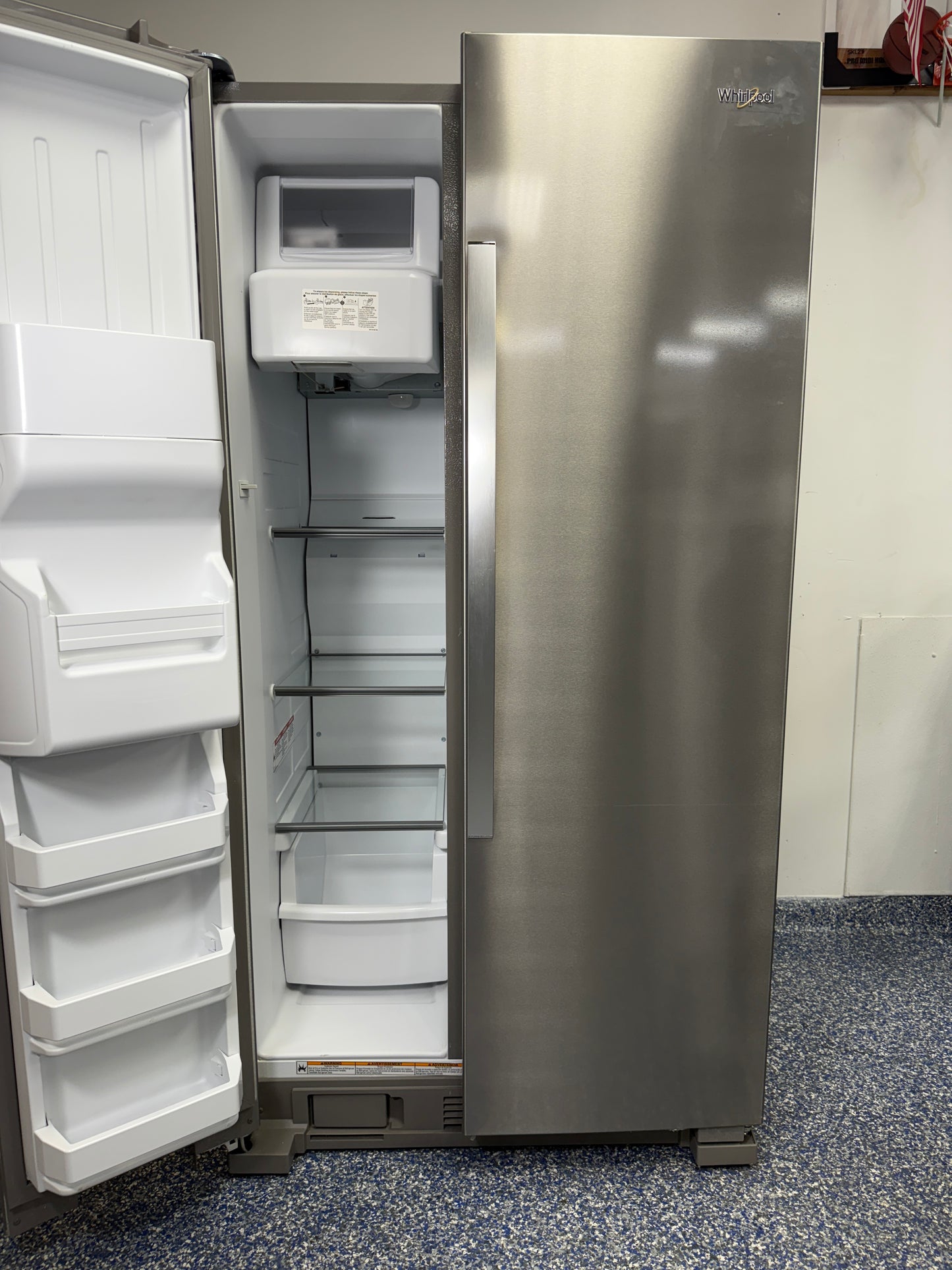 A detailed shot of the WRS325SDHZ freezer compartment, showcasing the efficient LED interior lighting and wire shelving.