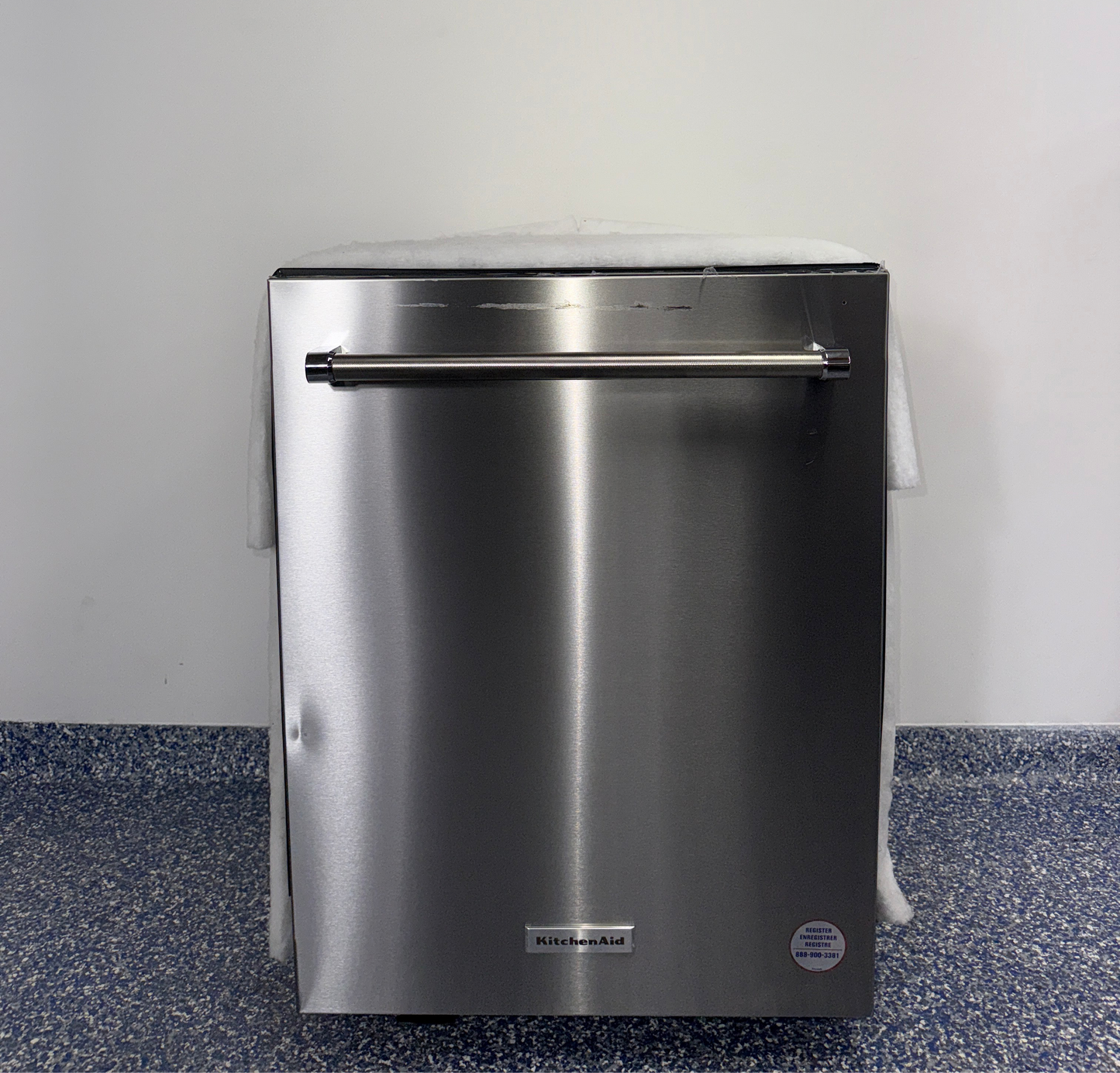 The KITCHENAID KDTM604KPS dishwasher from the front, highlighting its FreeFlexâ„¢ Third Rack and a great deal in Kansas.