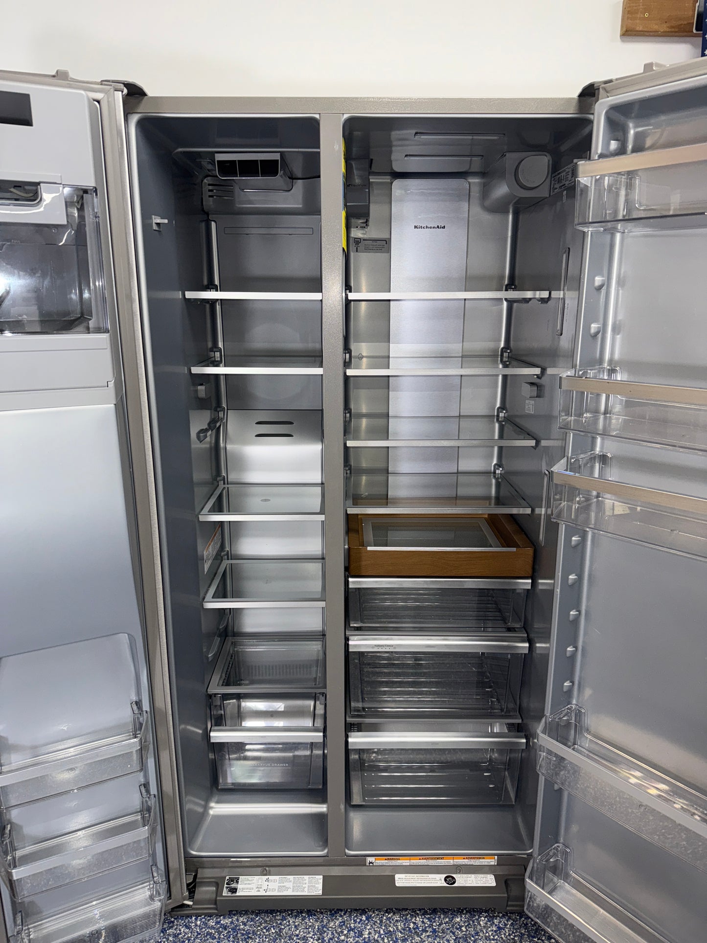 Interior view of the KITCHENAID KRSC536RPS00 refrigerator showing adjustable glass shelves and organized storage for Overland Park, KS homes.