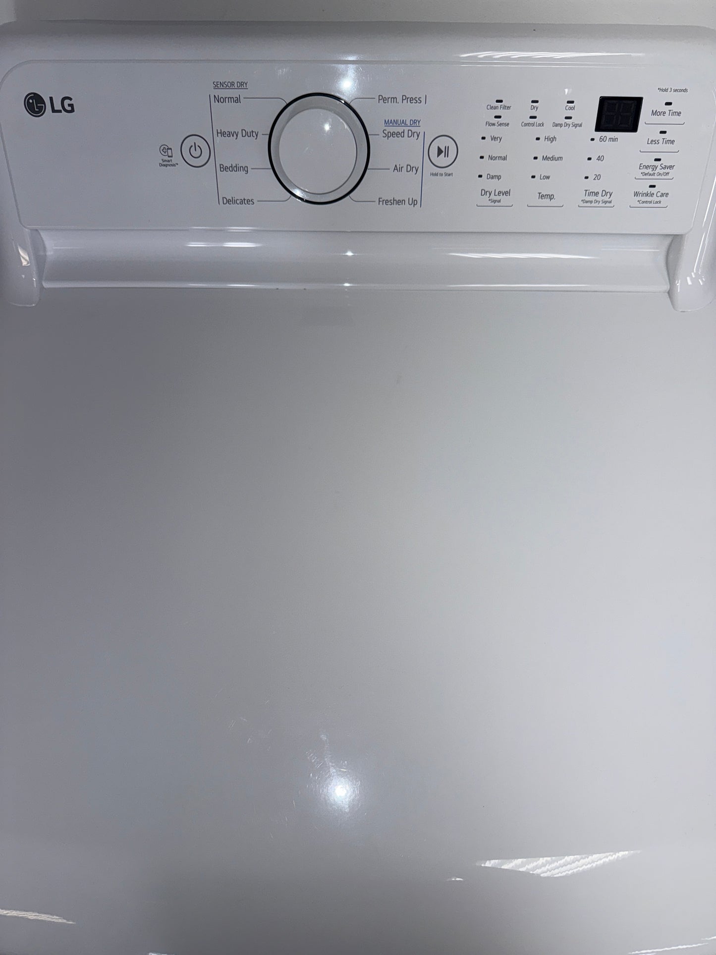 The interior of the LG DLE7000W dryer, showcasing the Wrinkle Care Option, for sale in Kansas.
