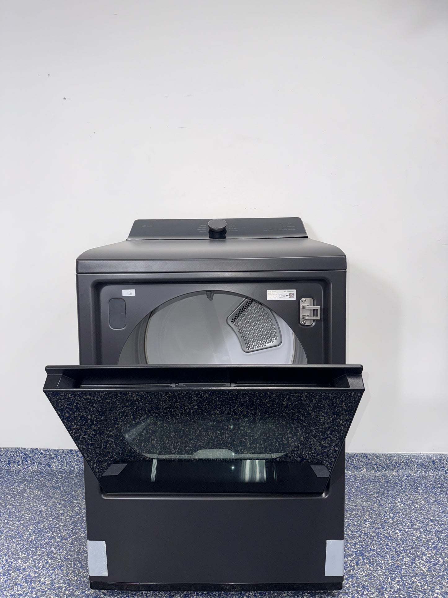 A side view of the LG DLG8401BE dryer, ready for installation in a Kansas City laundry room, with its SmartDiagnosis feature.