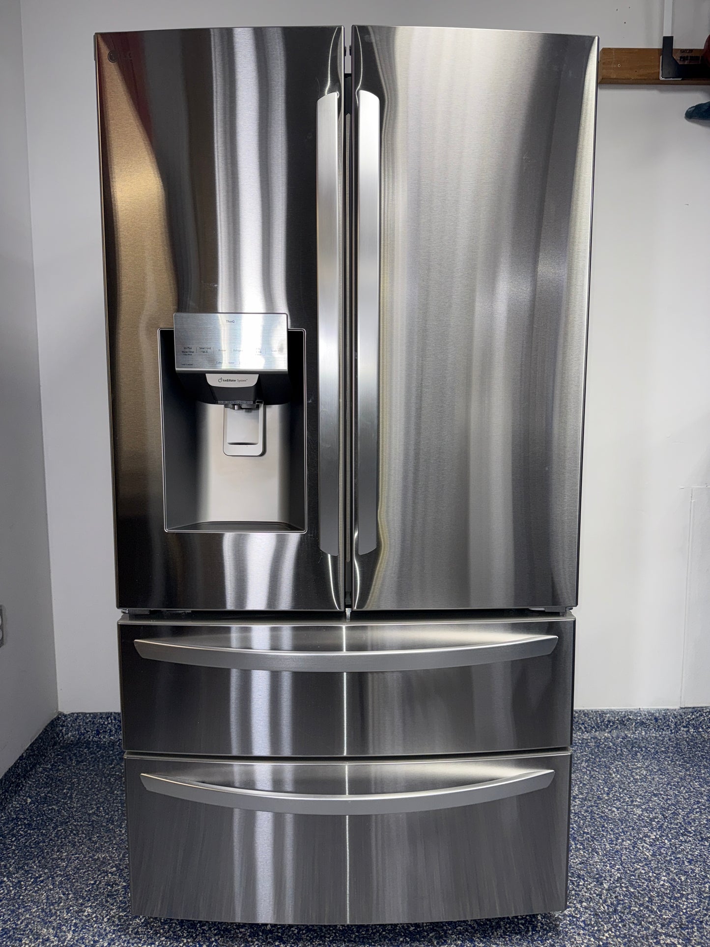 A view of the dual icemaker inside the LG LRMXS2806S refrigerator, for sale in Kansas.