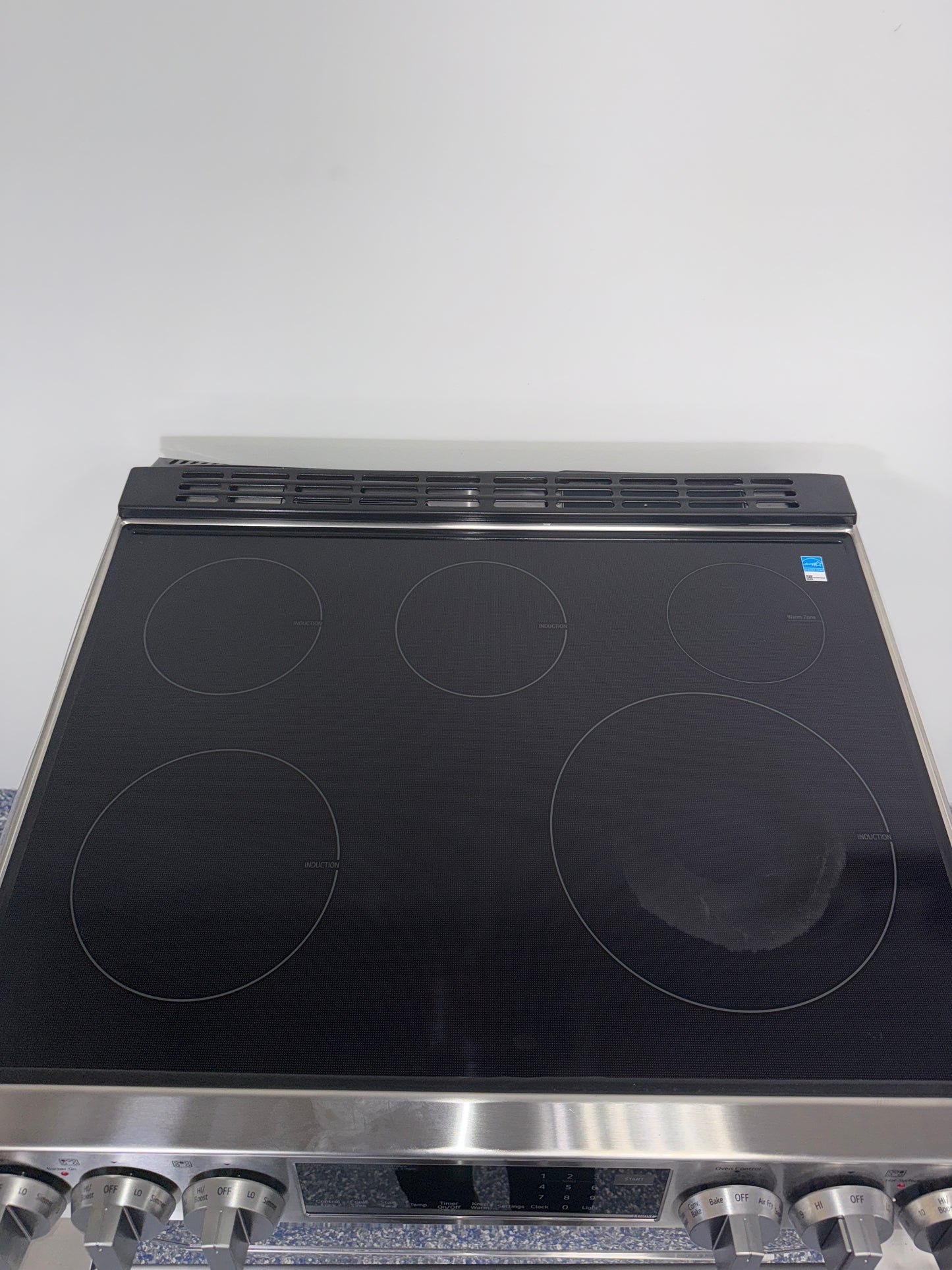 Wi-Fi enabled ThinQ® smart controls on LG LSIL6336XE induction range, scratch and dent special in Kansas City.