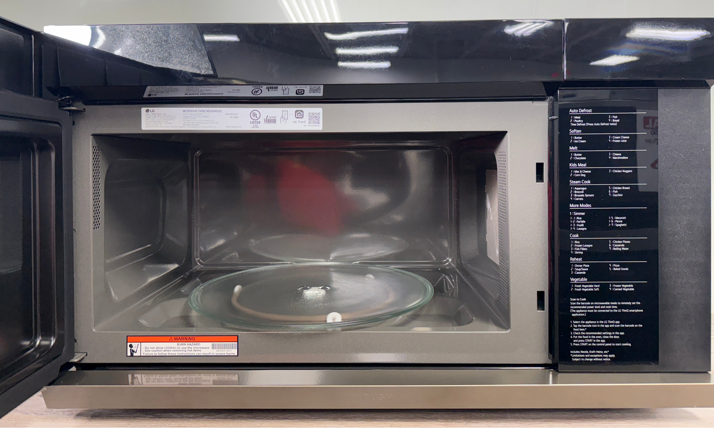 Scratch & dent LG MVEL2137F microwave displayed at Appliance Shark in Overland Park with smart Wi-Fi connectivity.
