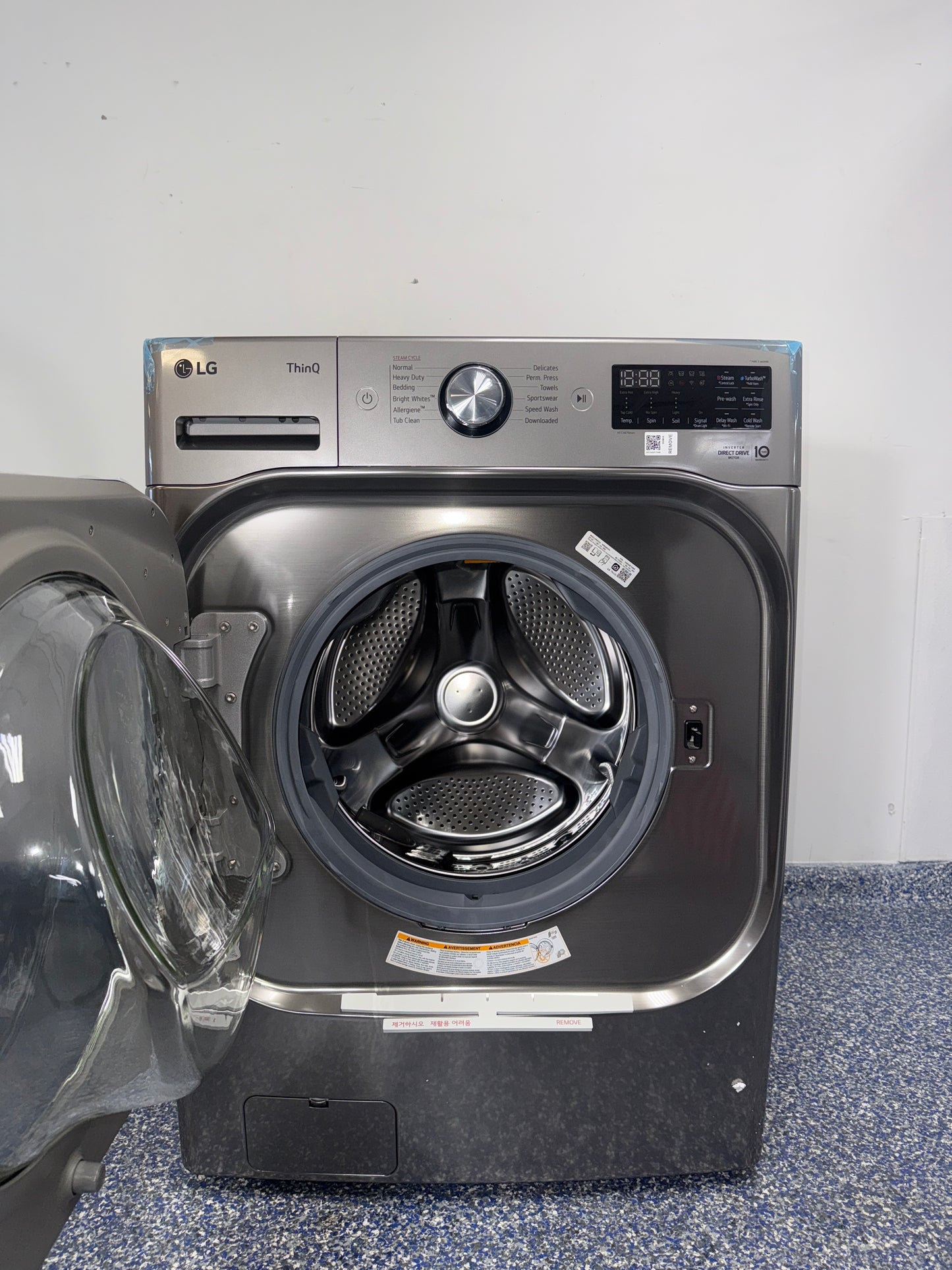 Control panel of the LG WM8980HVA showing ThinQ® and advanced wash options, featured in Kansas City homes.