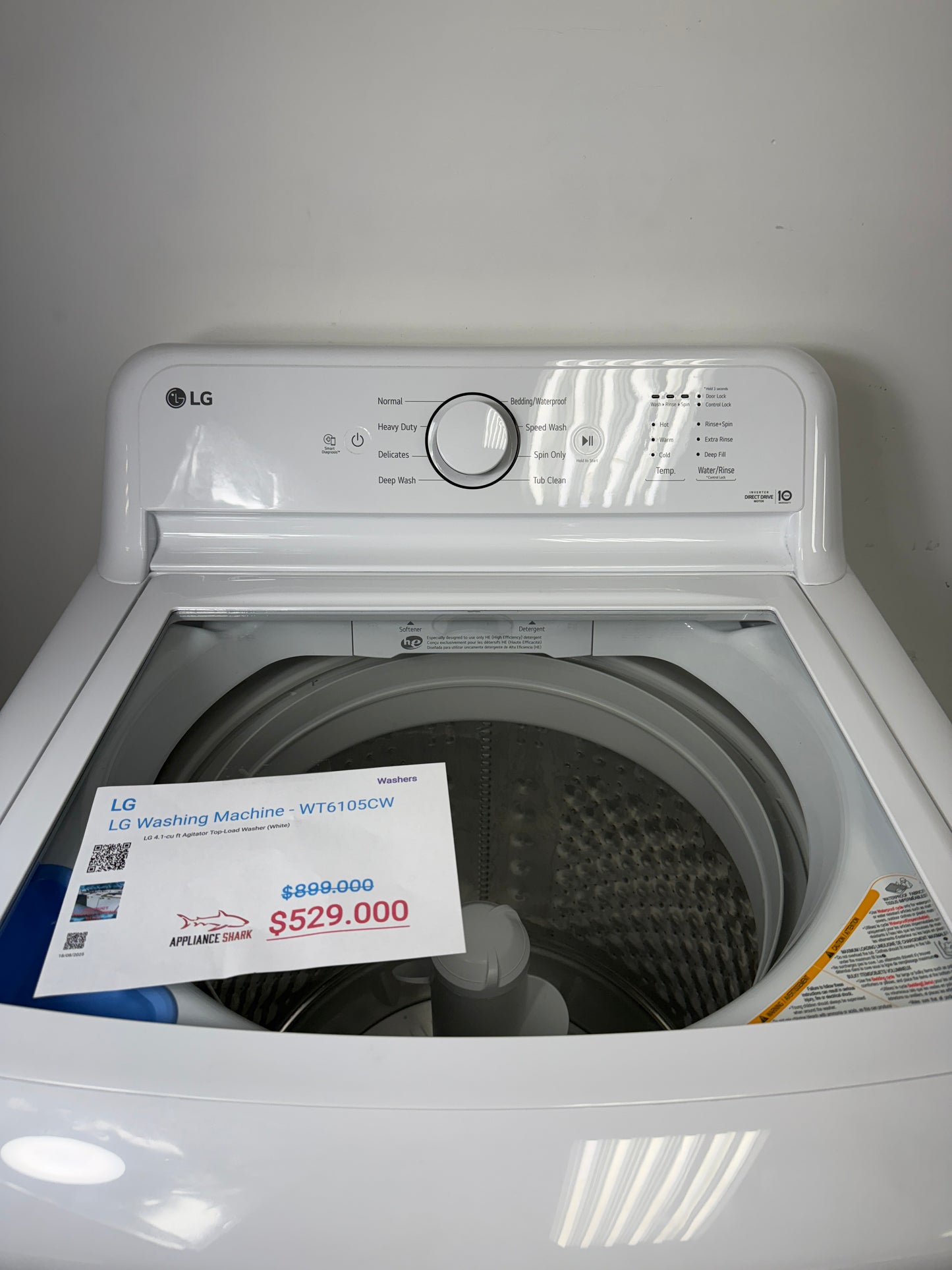 A detailed view of the simple electromechanical control knobs for the LG WT6105CW, showing the various wash cycles and options. On sale at Appliance Shark - Scratch & Dent store | Kansas City.