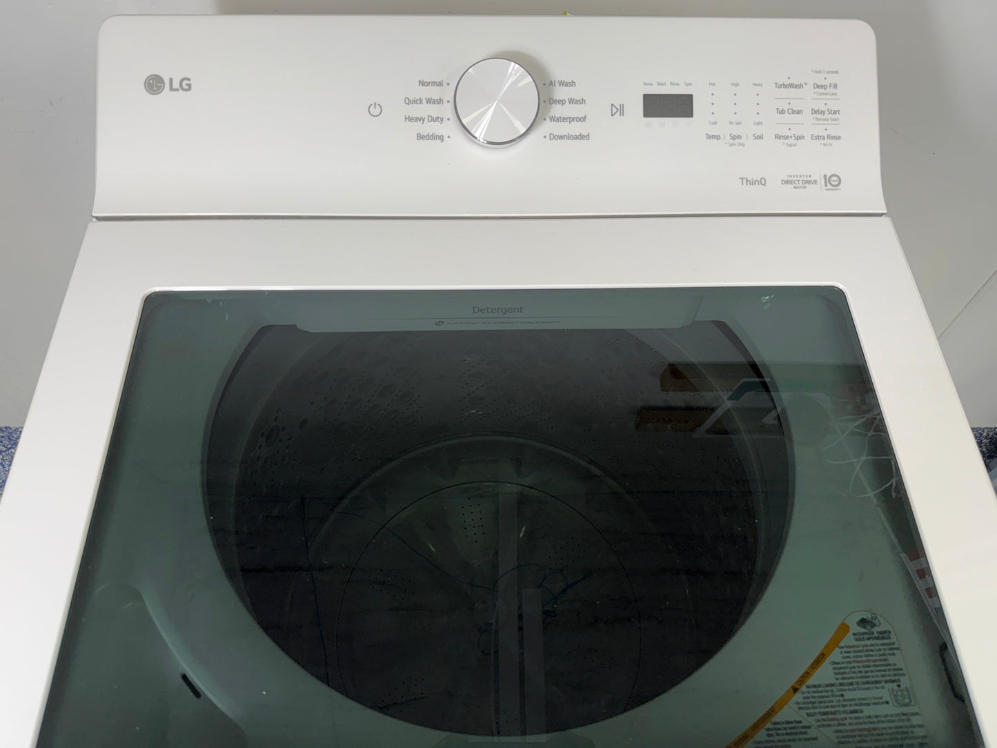 Close-up of the LG WT8200CW washer's control panel, showing the cycle selector dial. On sale at Appliance Shark - Scratch & Dent store | Kansas City.