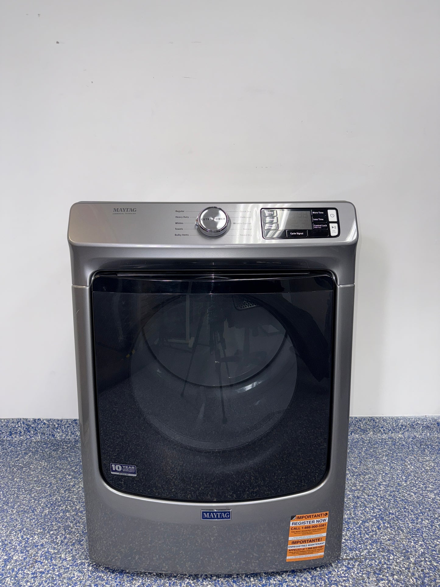 A front view of the MAYTAG MED5630HC dryer, highlighting its heavy-duty motor, ready for installation in a Kansas City laundry room.