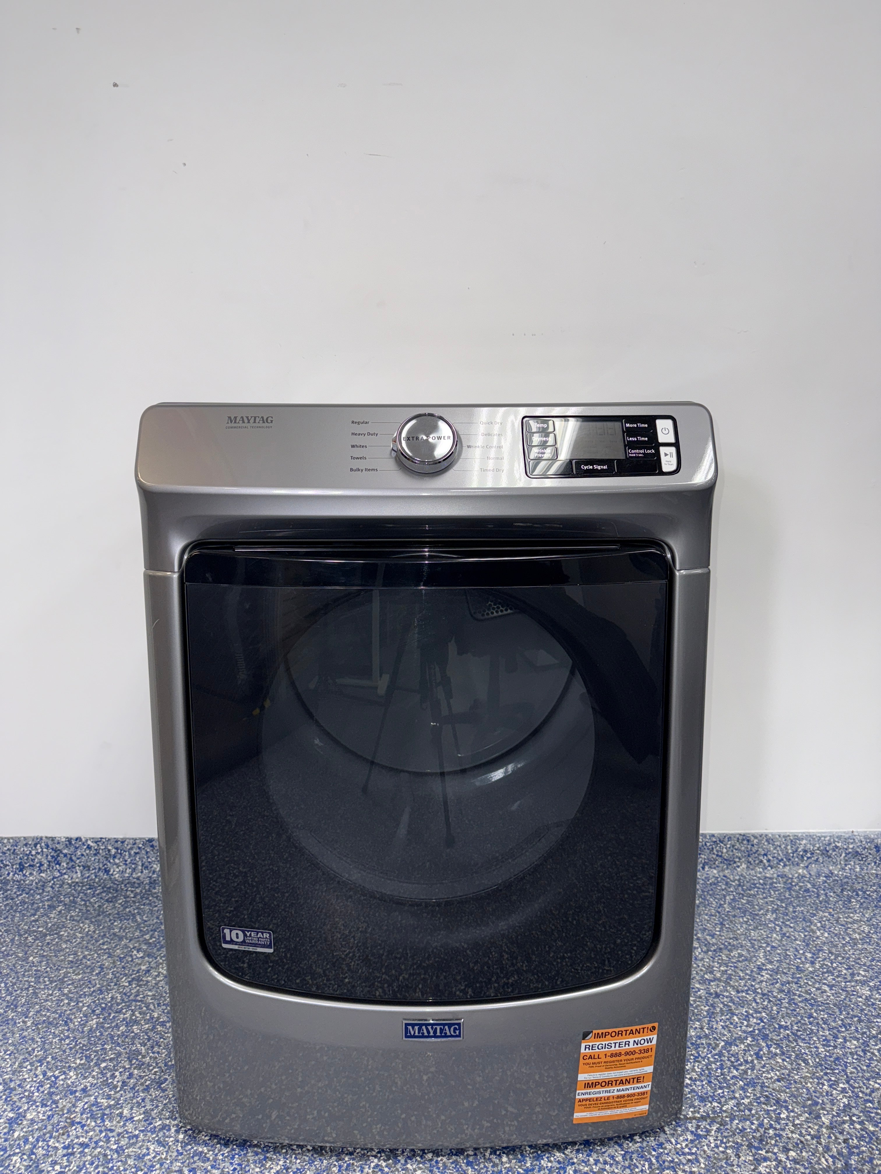 A front view of the MAYTAG MED5630HC dryer, highlighting its heavy-duty motor, ready for installation in a Kansas City laundry room.