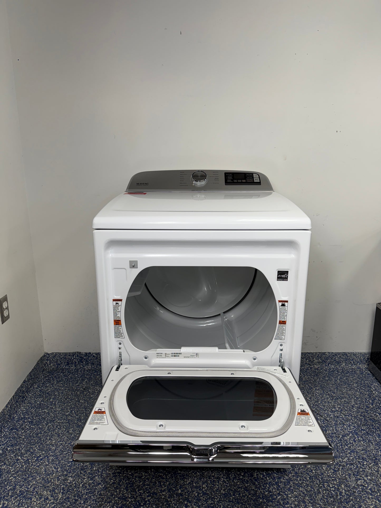 An overhead shot of the Maytag MED7230HW with the hamper-style door open, showcasing the spacious drum interior. On sale at Appliance Shark - Scratch & Dent store | Kansas City.