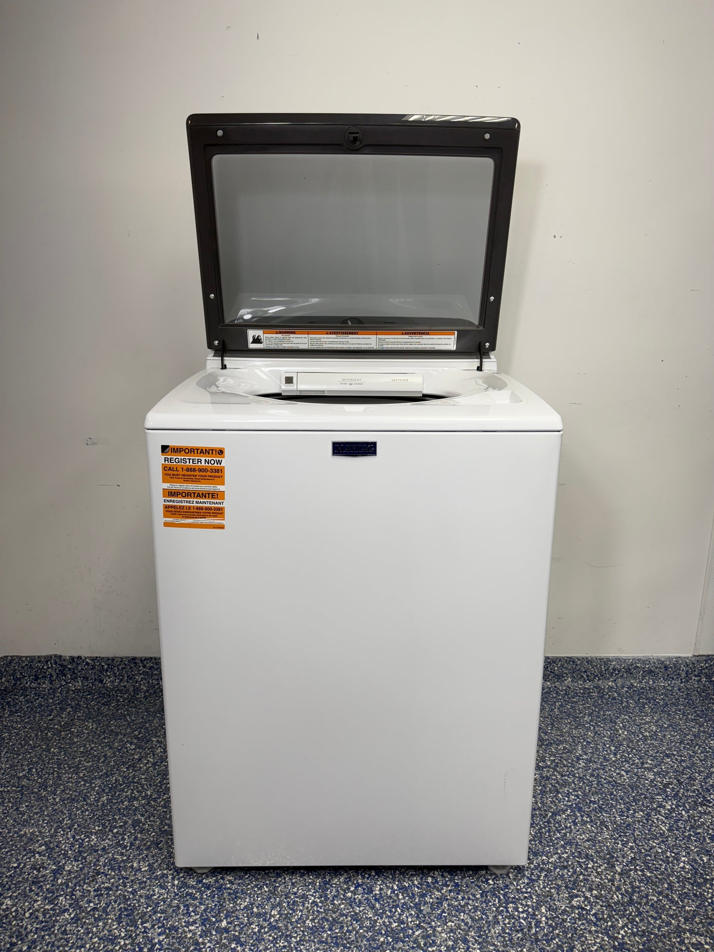 An overhead shot of the Maytag MVW6500MW with the lid open, showcasing the spacious stainless steel tub and Powerâ„¢ Agitator. On sale at Appliance Shark - Scratch & Dent store | Kansas City.