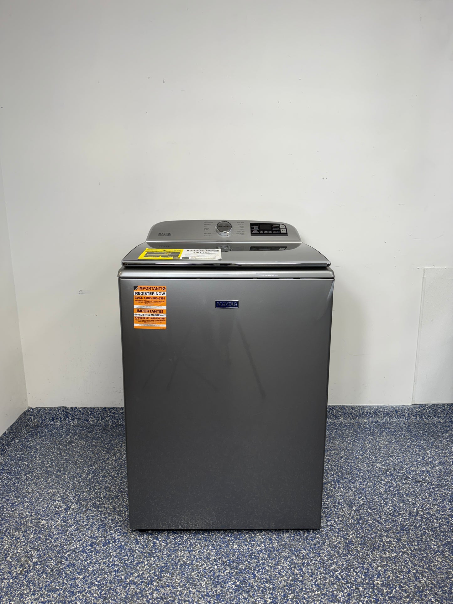 A full frontal image of the Maytag MVW7230HC top-load washing machine, highlighting its Metallic Slate finish and control panel. On sale at Appliance Shark - Scratch & Dent store | Kansas City.