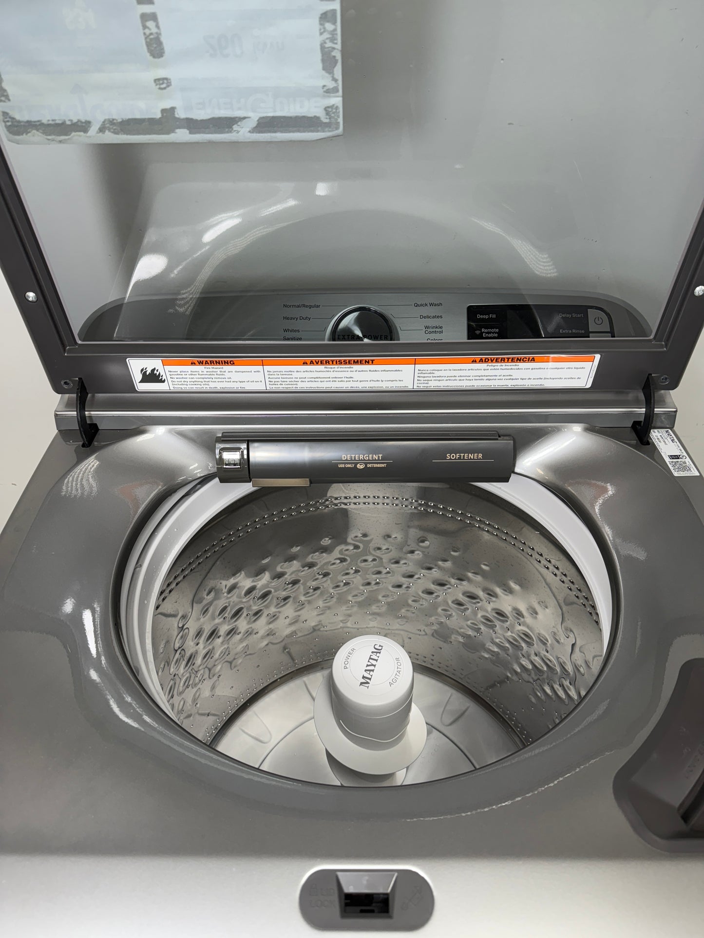 A close-up of the durable stainless steel wash basket and Powerâ„¢ Agitator inside the MVW7230HC washer, designed for tough messes. On sale at Appliance Shark - Scratch & Dent store | Kansas City.