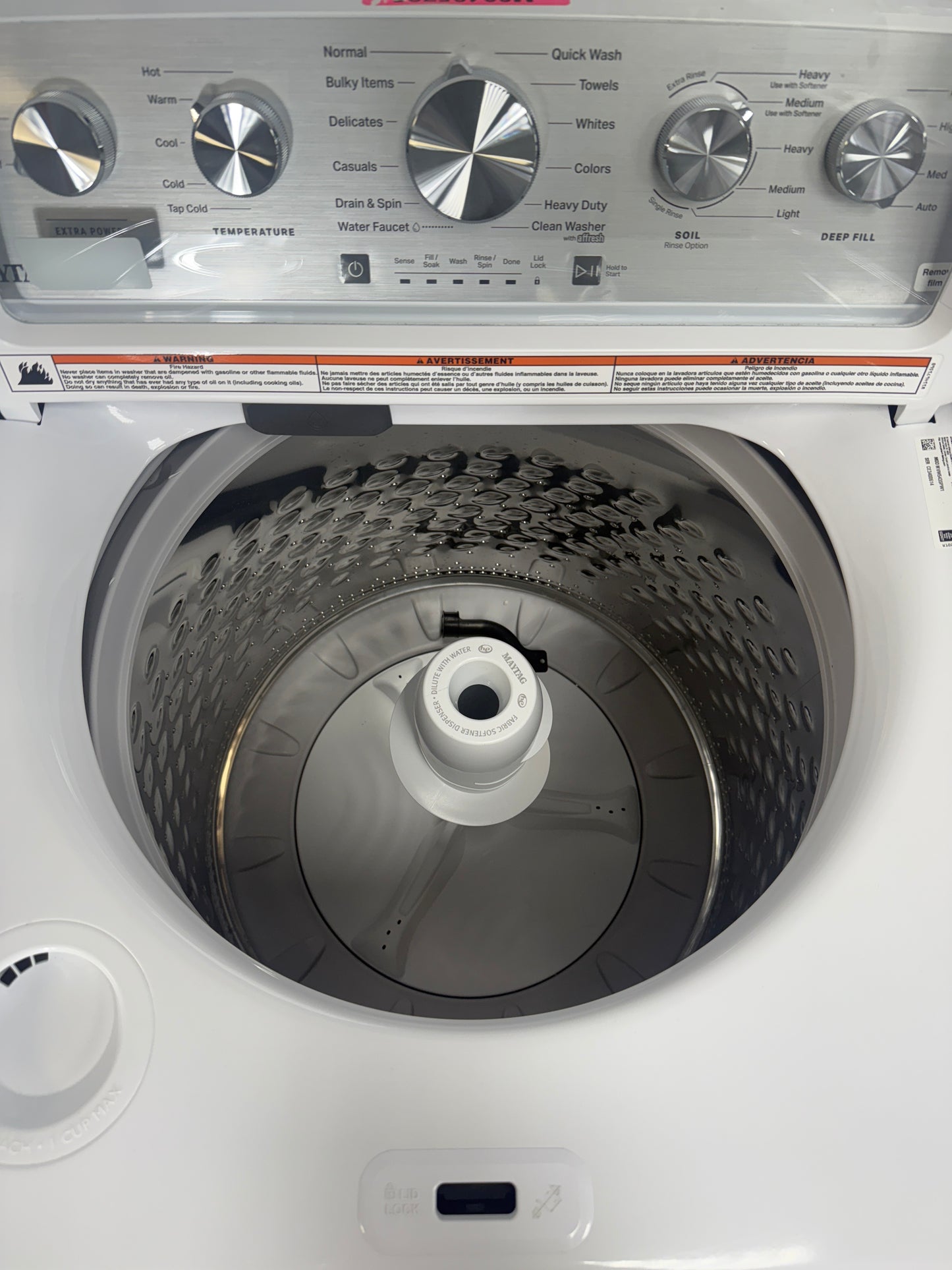 A close-up view of the interior of the MAYTAG MVW5435PW washer, showcasing its stainless steel wash drum, perfect for an Overland Park, KS home.