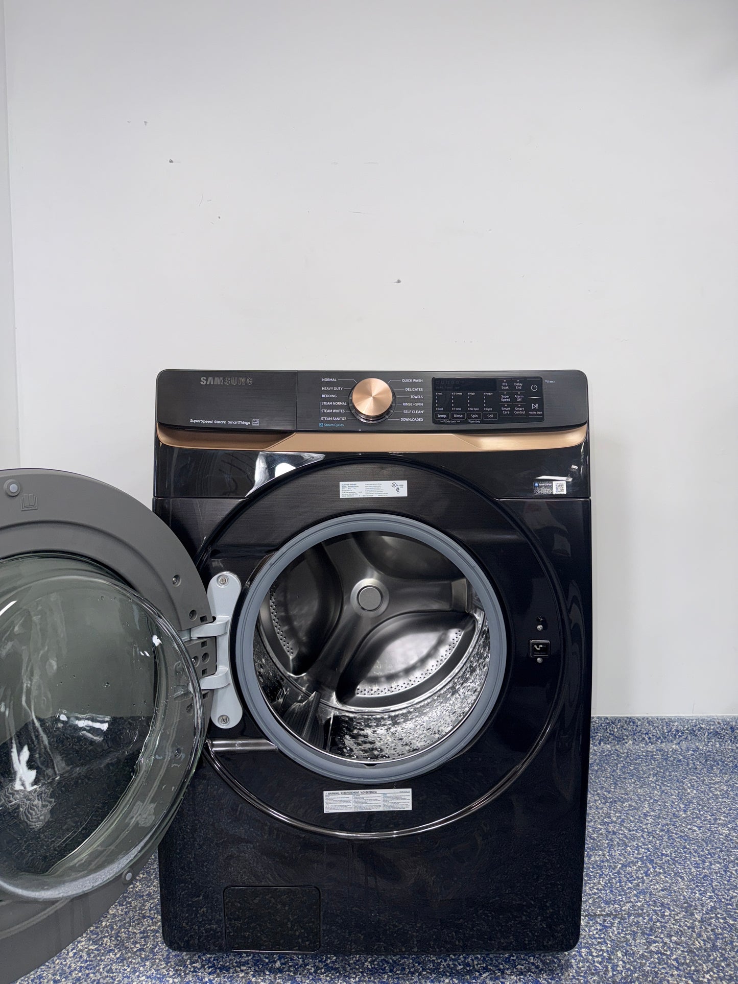 The SAMSUNG 5.0 cu. ft. front load washer, model WF50BG8300AVUS, available at Appliance Shark.