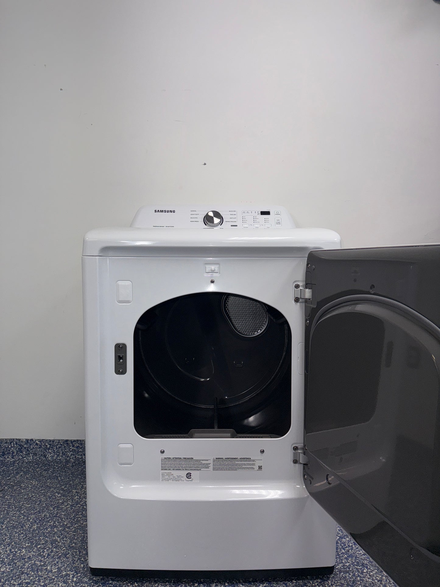 The SAMSUNG DVE45T3200W electric dryer from the front, highlighting its Wrinkle Prevent Option and a great deal in Kansas.
