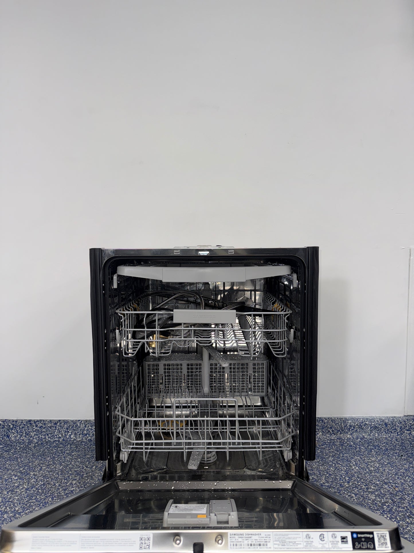 StormWash+™ rotating jets inside SAMSUNG DW80CG5450MT dishwasher, available as a scratch and dent deal in Kansas City.