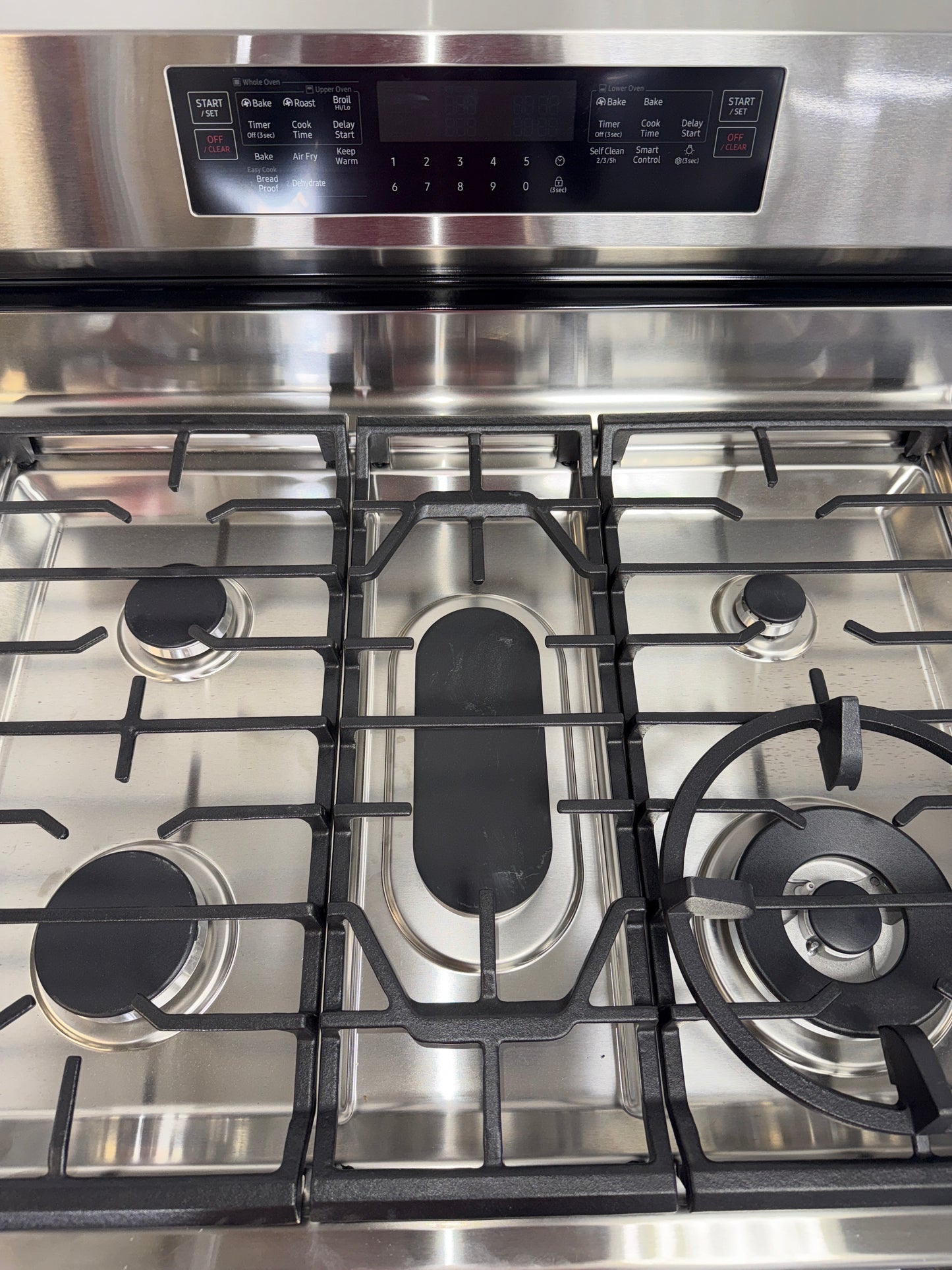 SAMSUNG NX60A6751SS smart gas range with Wi-Fi connectivity, discounted as a scratch and dent appliance at Appliance Shark in Kansas City.