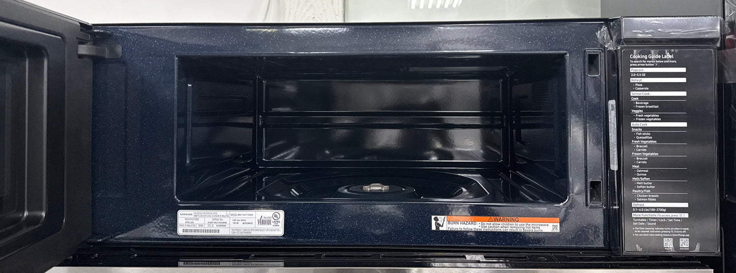 Interior cavity of the SAMSUNG ME11A7710DS microwave with door open, featured in Kansas City homes.