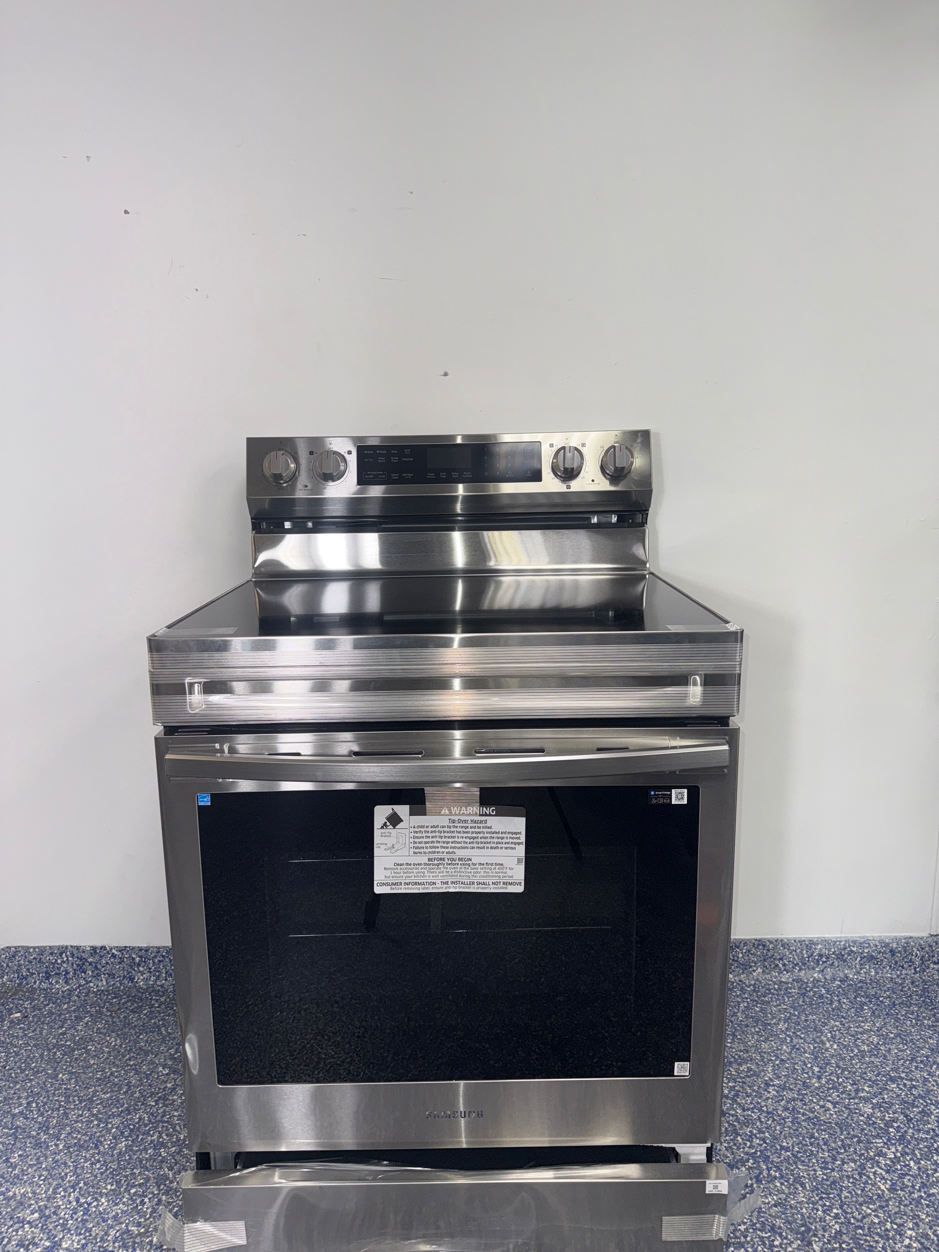 The SAMSUNG NE63D6711SR electric range from the front, highlighting its No-Preheat Air Fry mode and a great deal in Kansas.