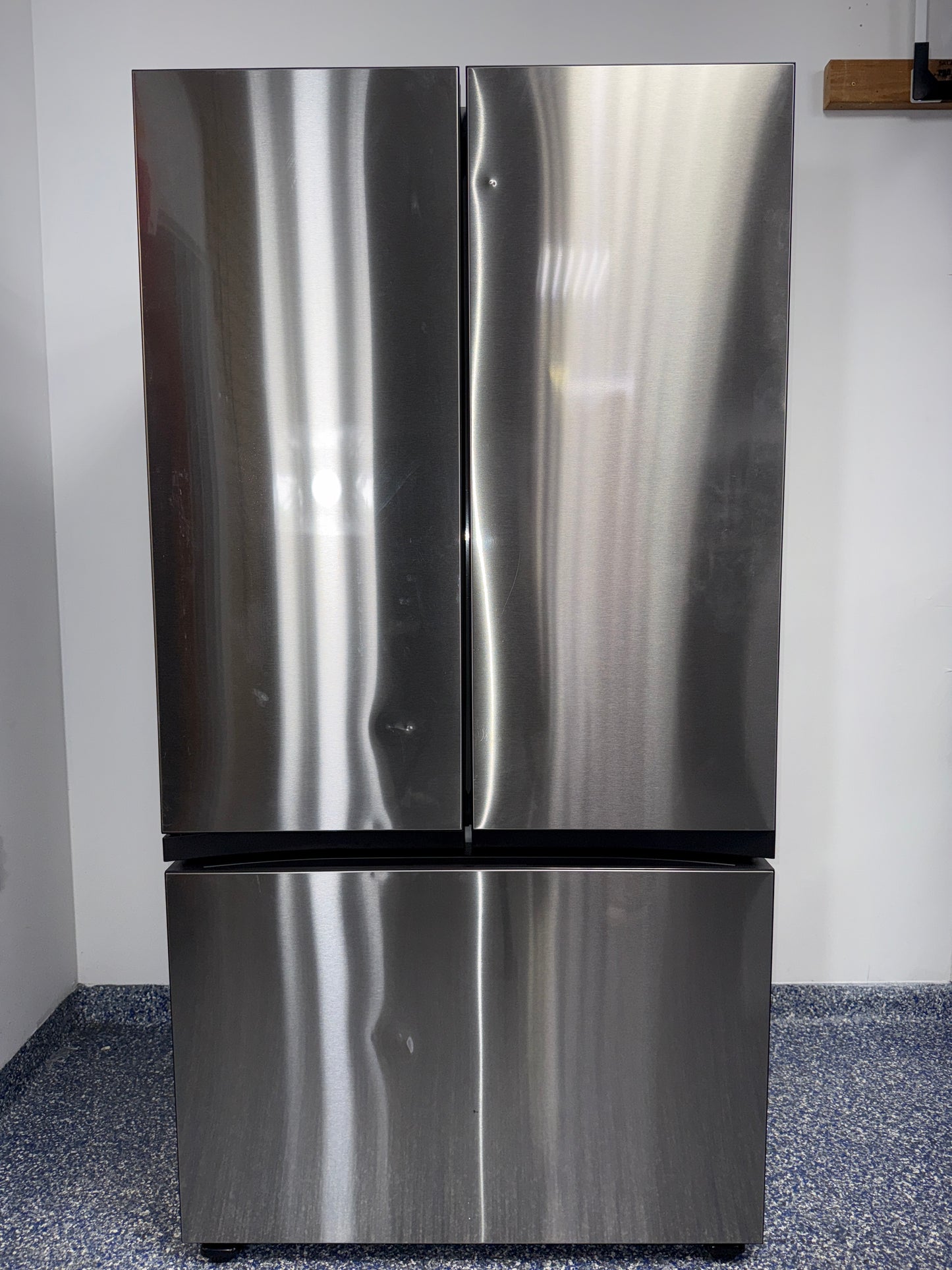 The SAMSUNG RF24BB6600QL refrigerator from the front, a counter-depth model highlighting its concealed Beverage Centerâ„¢ and a great deal in Kansas.