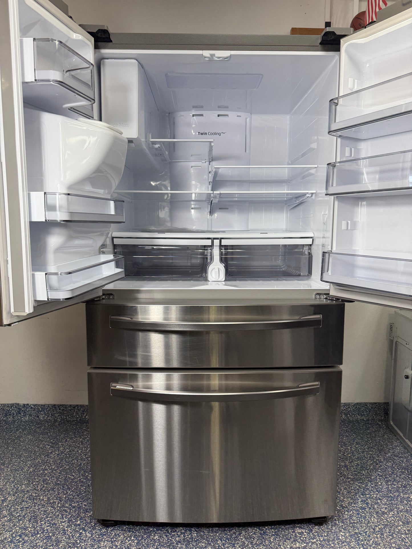Top view of the Samsung RF28R7201SR refrigerator with both French doors open, showing the spacious interior and Food Showcase door. On sale at Appliance Shark - Scratch & Dent store | Kansas City.