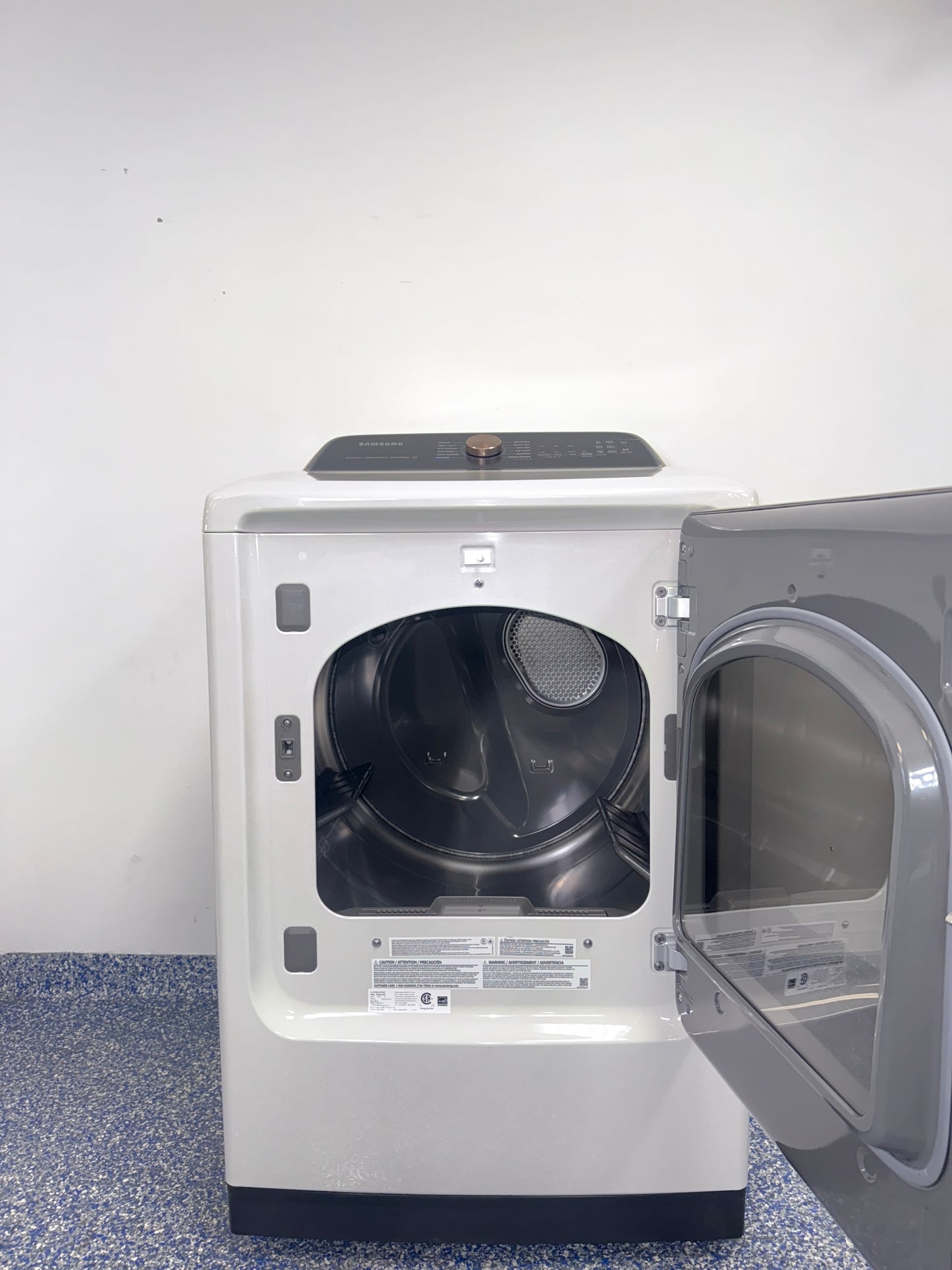 A view of the control panel and door on the SAMSUNG DVG55CG7500E dryer, showcasing its Steam Sanitize+ option, perfect for an Overland Park, KS home.