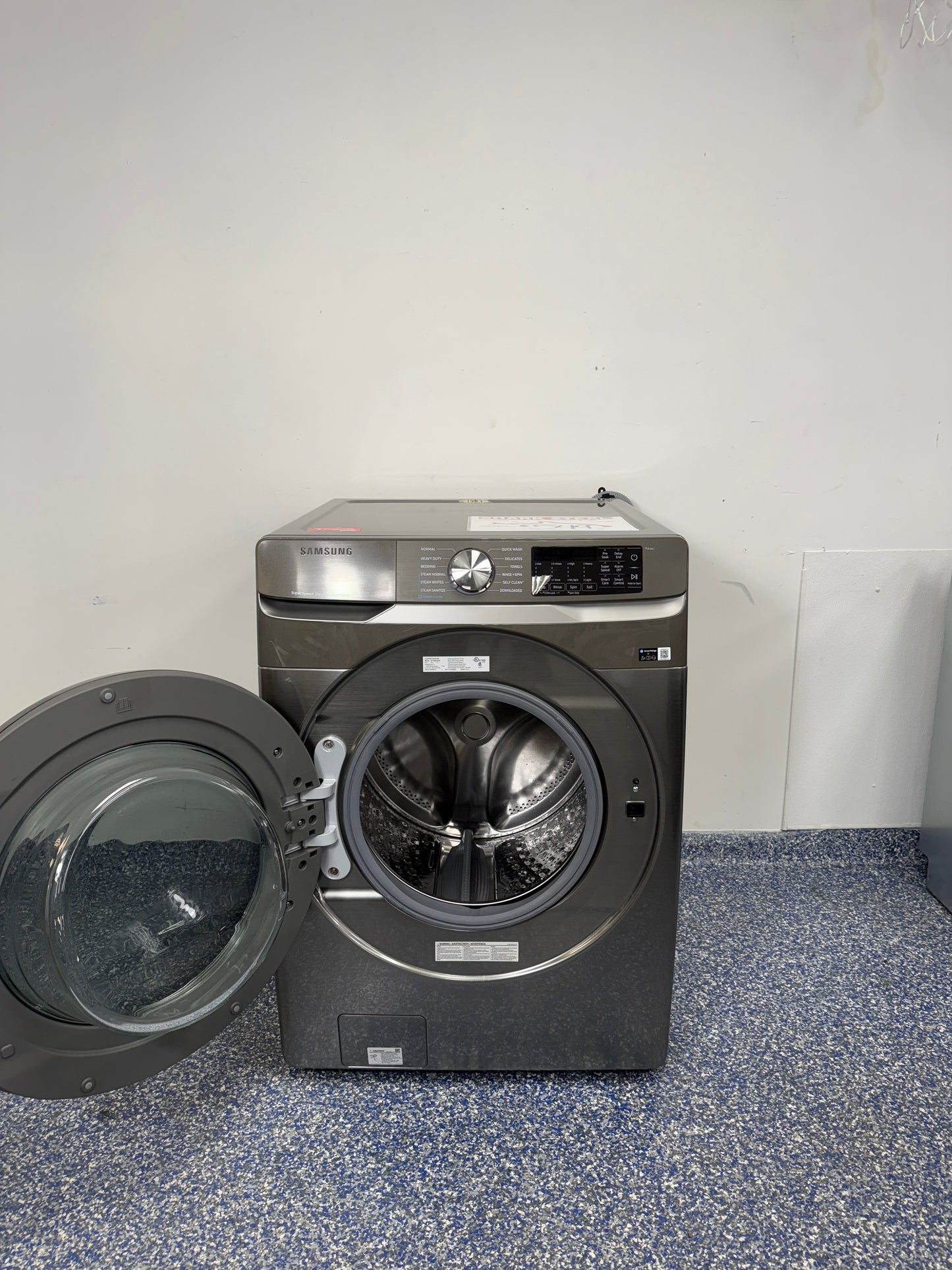 A close-up view of the interior of the SAMSUNG WF45B6300AP washer, showcasing its Steam Wash feature, perfect for an Overland Park, KS home.
