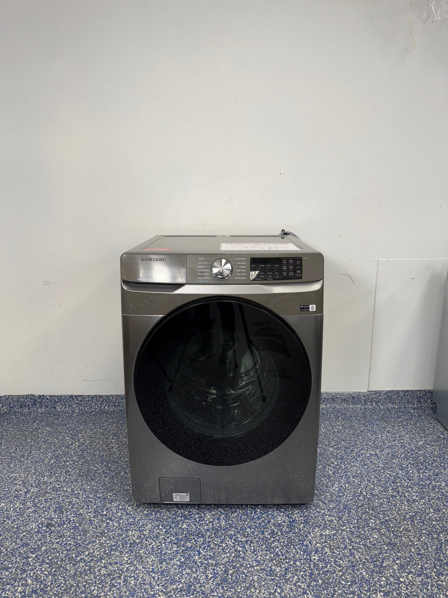 The SAMSUNG WF45B6300AP front load washer from the front, highlighting its Super Speed Wash feature and a great deal in Kansas.