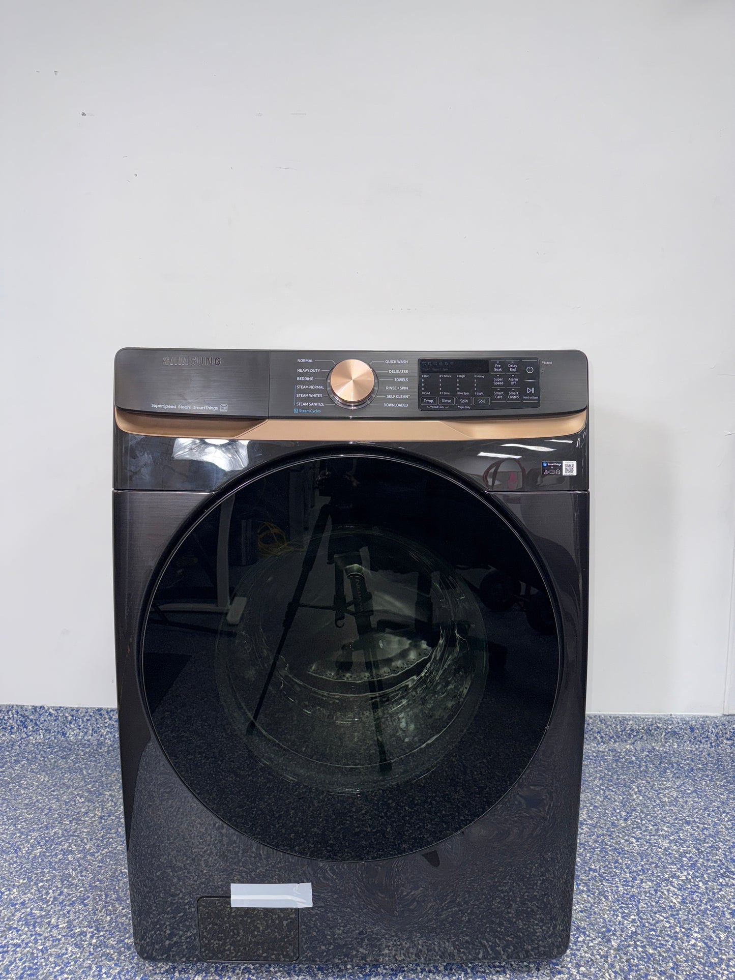 The SAMSUNG WF50BG8300AVUS front load washer from the front, highlighting its Super Speed Wash feature and a great deal in Kansas.