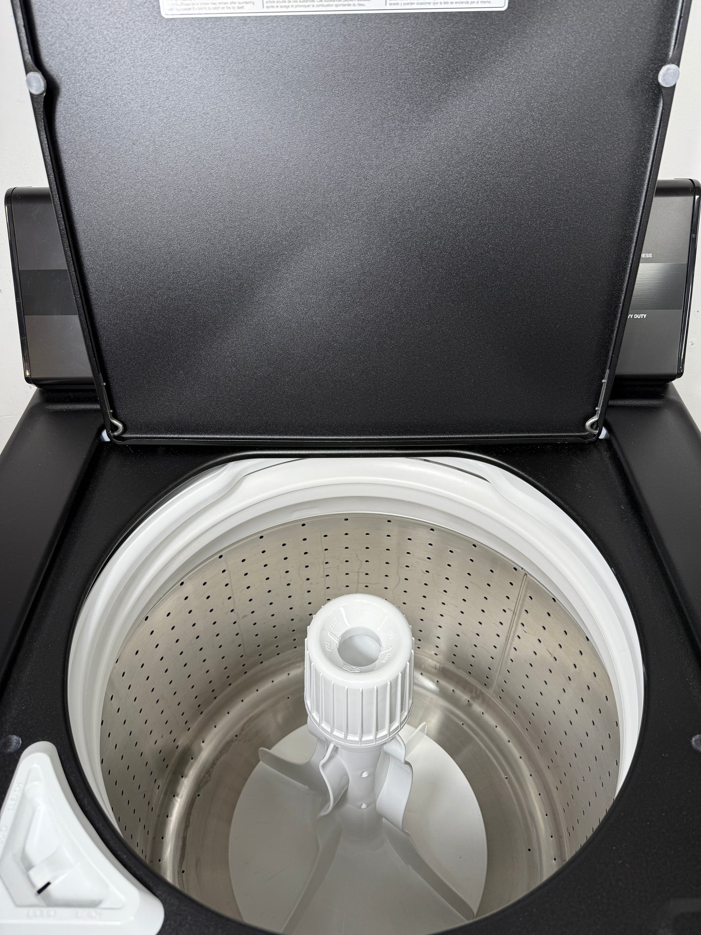 Speed Queen TC5 3.2 cu ft black top load washer (TC5003BN) with lid open drum interior with agitator