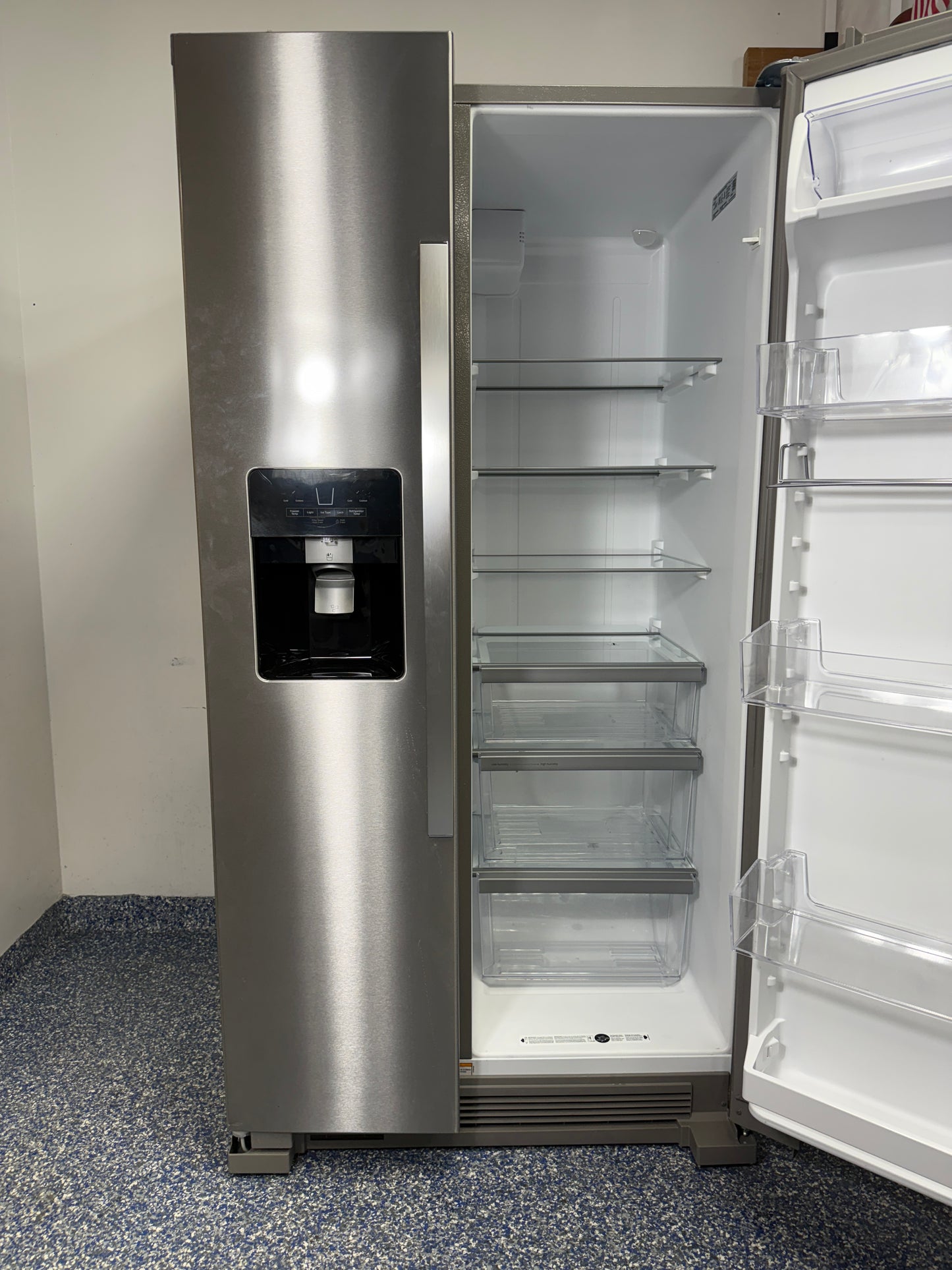 A close-up of the easy-to-use exterior electronic temperature controls and dispenser on the WRS325SDHZ refrigerator.