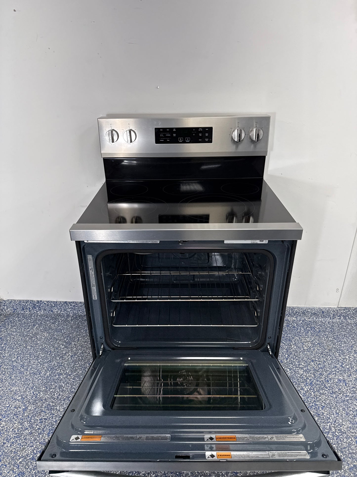 Control panel and cooking modes on the WHIRLPOOL WFES5030RZ electric range in the Kansas City Metro area.