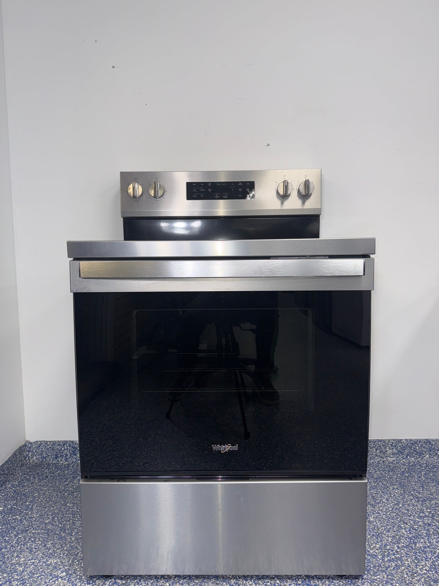 The WHIRLPOOL WFES5030RZ electric range from the front, highlighting its Frozen Bake™ Technology and a great deal in Kansas.