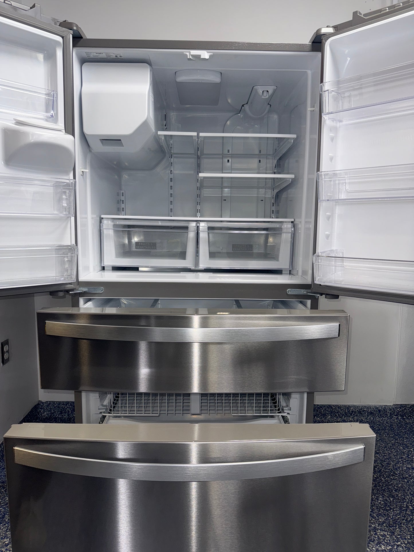 Interior view showing LED lighting and shelving layout of the WHIRLPOOL WRMF3636RZ00 refrigerator, featured in Kansas City homes.