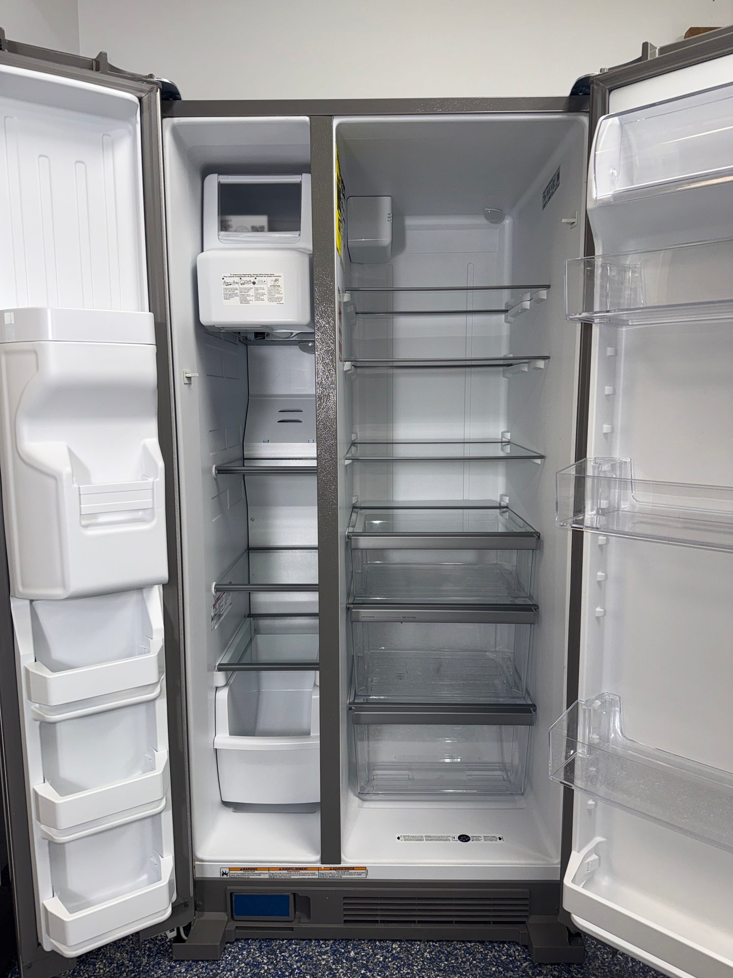Adjustable gallon door bins inside the WHIRLPOOL WRS321SDHZ refrigerator serving the Kansas City area.