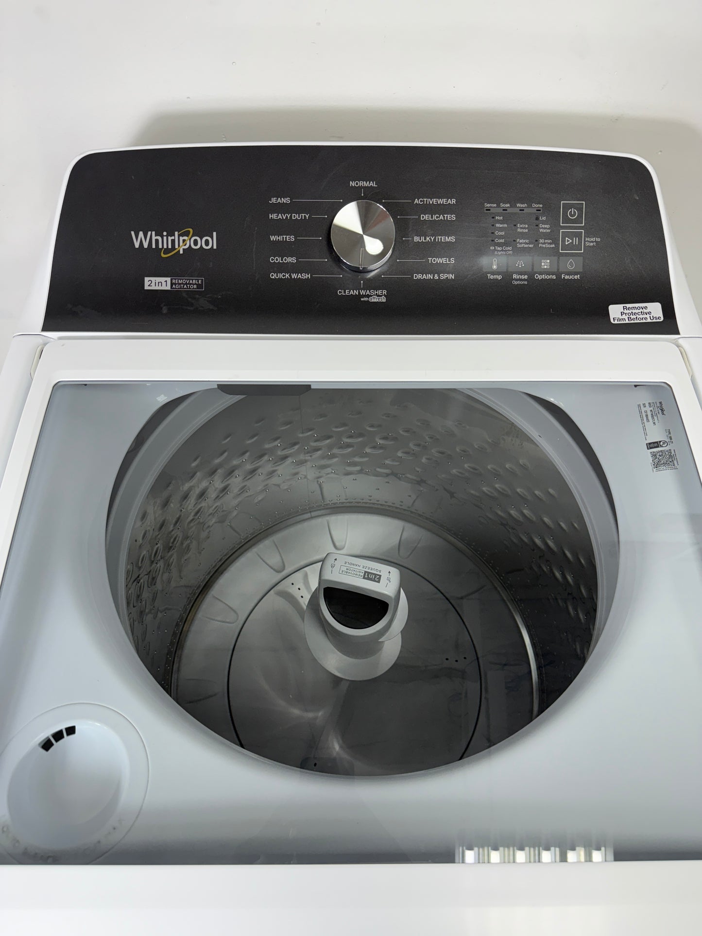 A detailed shot of the electromechanical control knobs on the Whirlpool WTW5057LW, showing the various cycles and settings. Get this scratch & dent appliance at a discount.